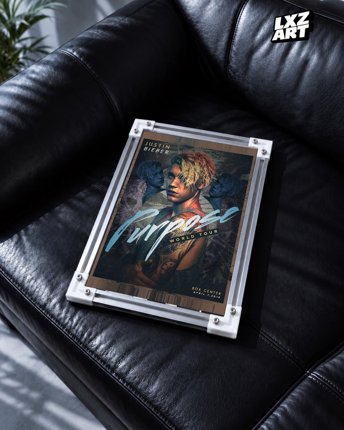 Justin Bieber Purpose World Tour Tulsa Portrait Poster displayed in a white-corner frame on a black leather sofa. Frame for display only.