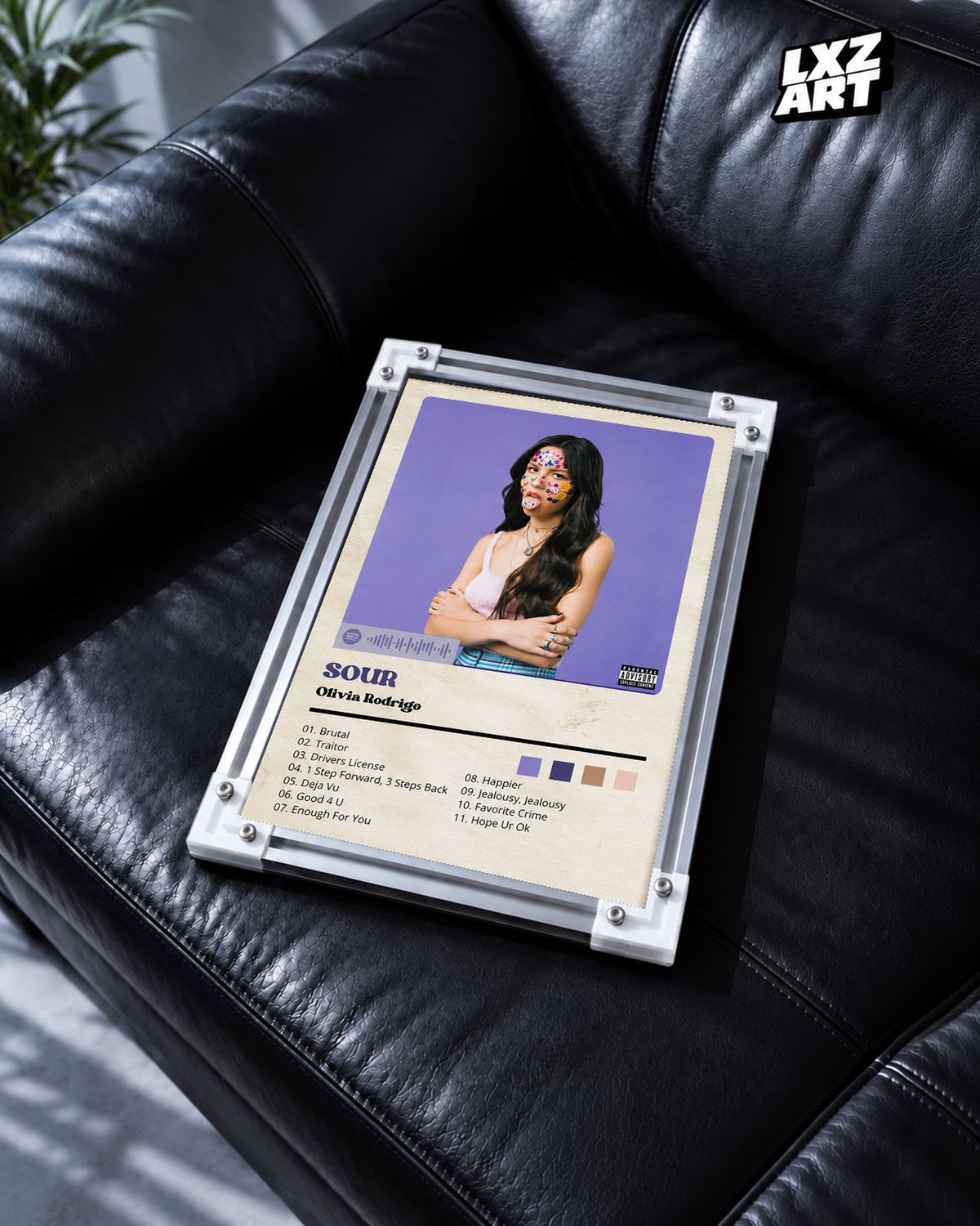 Olivia Rodrigo SOUR Purple Tracklist Poster — black leather sofa; frame for display only