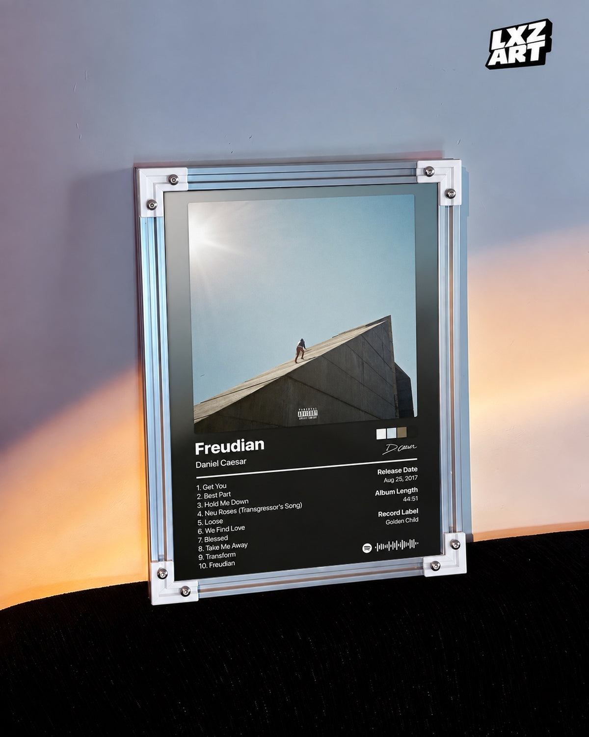 Daniel Caesar Freudian Tracklist Poster — warm light wall; frame for display only