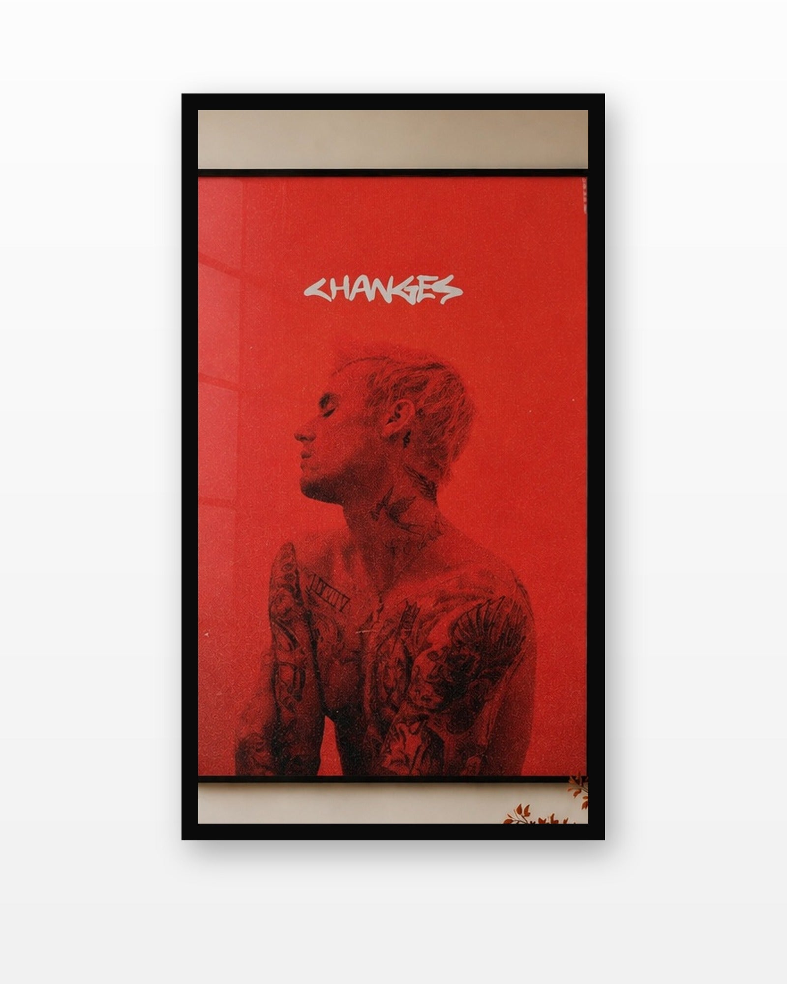 Justin Bieber Changes Red Album Poster in a black frame on a white wall