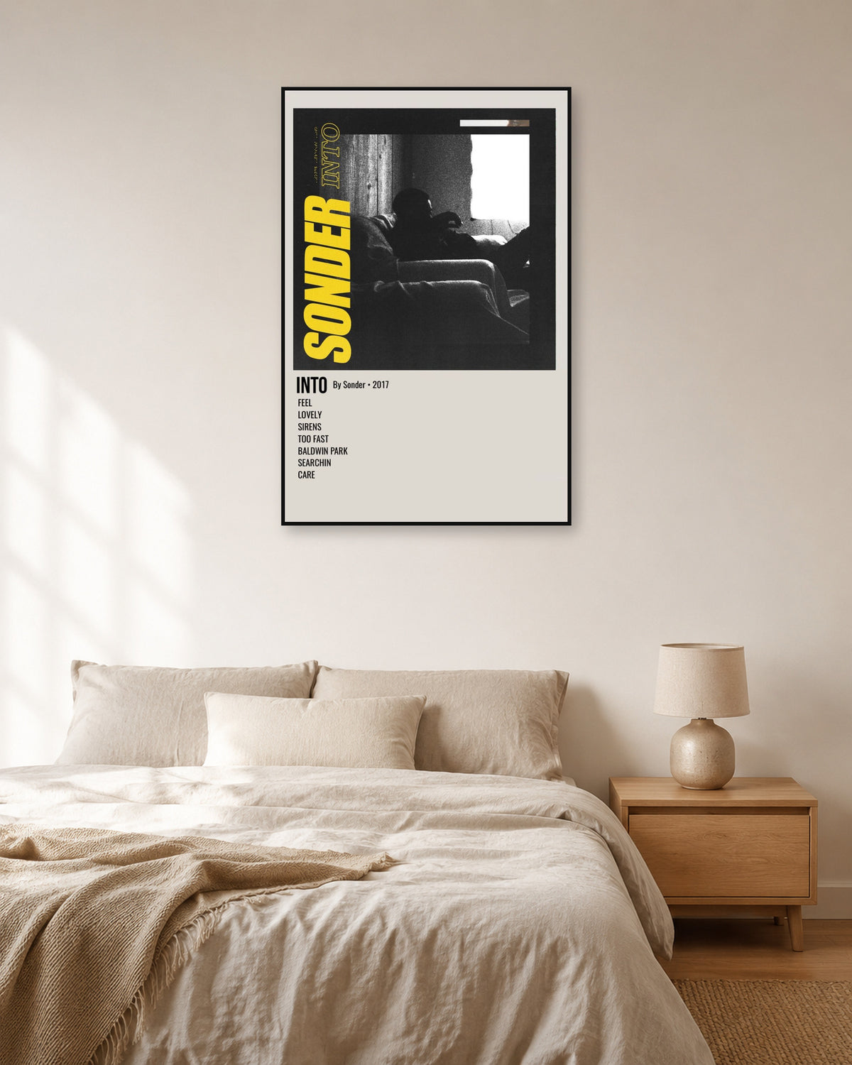 Brent Faiyaz Into Sonder Yellow Tracklist Poster — natural-light bedroom display. Print sold unframed; frame for display only.