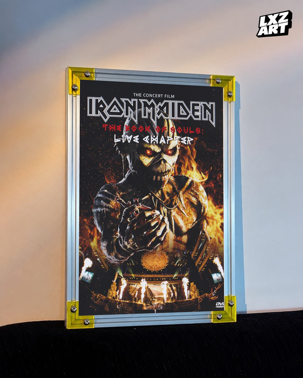 Iron Maiden The Book of Souls Live Chapter Concert Film poster displayed against a warm wall in a yellow-corner frame; unframed print, frame not included
