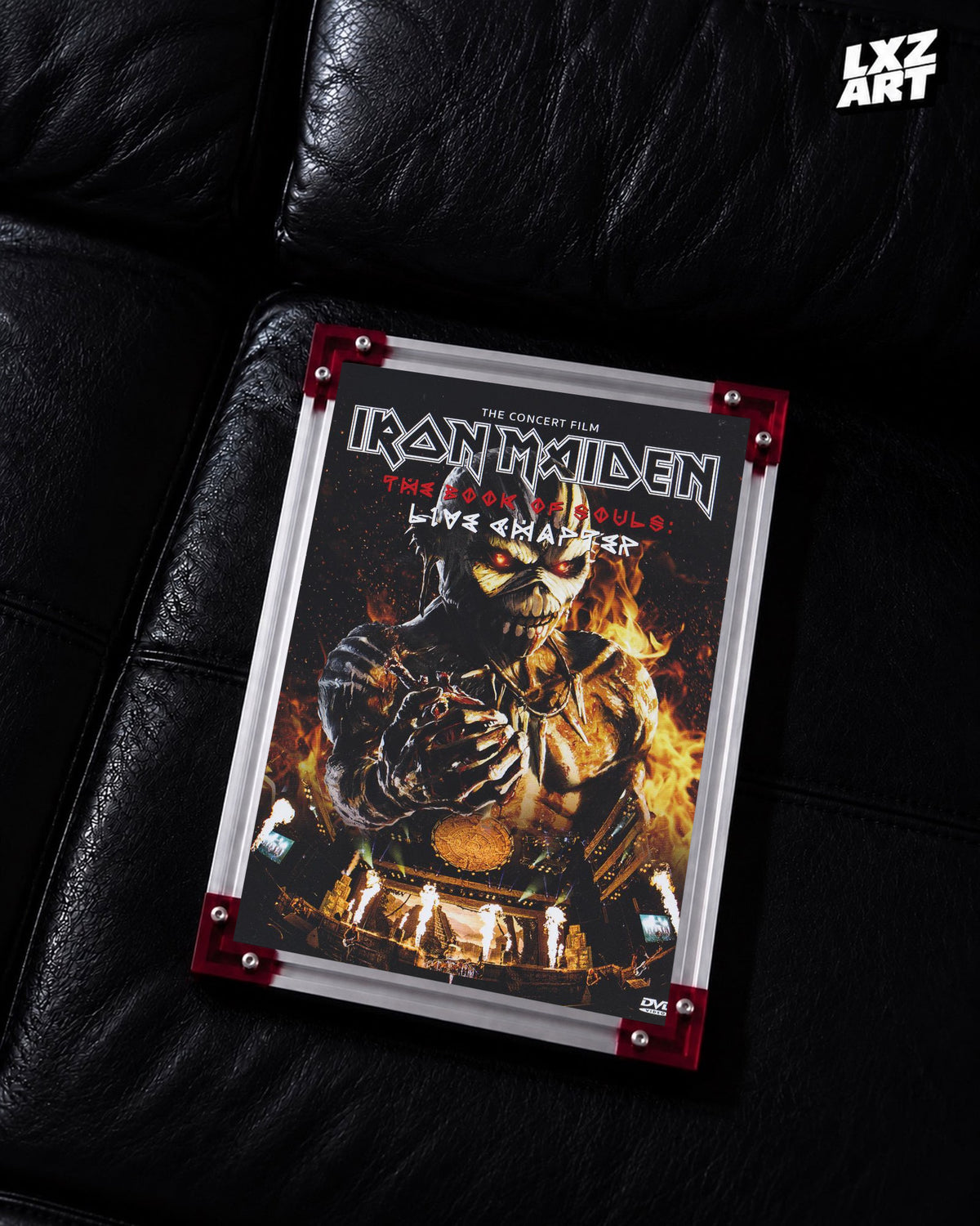 Iron Maiden The Book of Souls Live Chapter Concert Film poster displayed on a black leather sofa in a red-corner frame; unframed print, frame not included