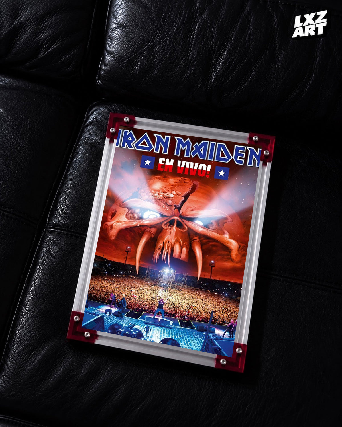 Iron Maiden En Vivo Concert Film poster displayed on a black leather sofa in a red-corner frame; unframed print, frame not included