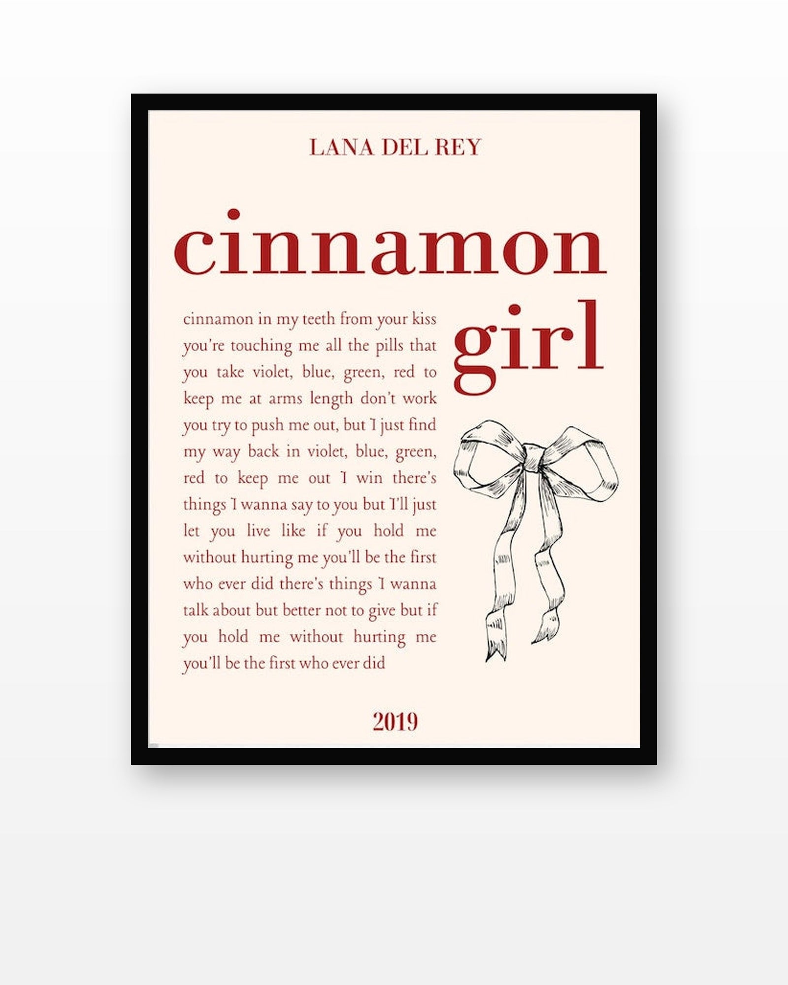 Lana Del Rey Cinnamon Girl Lyric Poster in a black frame on a white wall