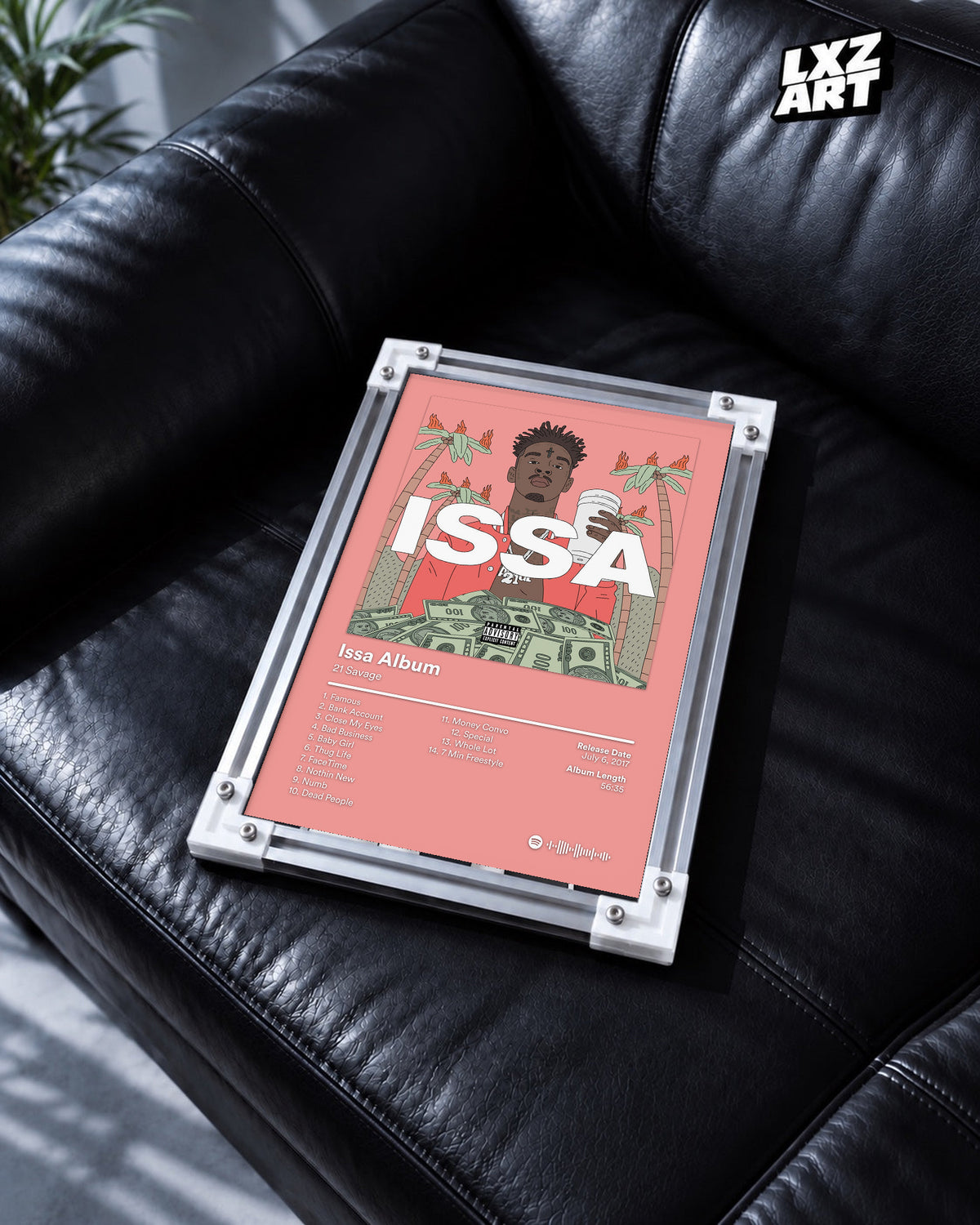 21 Savage Issa Album Pink Tracklist Poster | Unframed Wall Art displayed on a black leather sofa; frame not included.