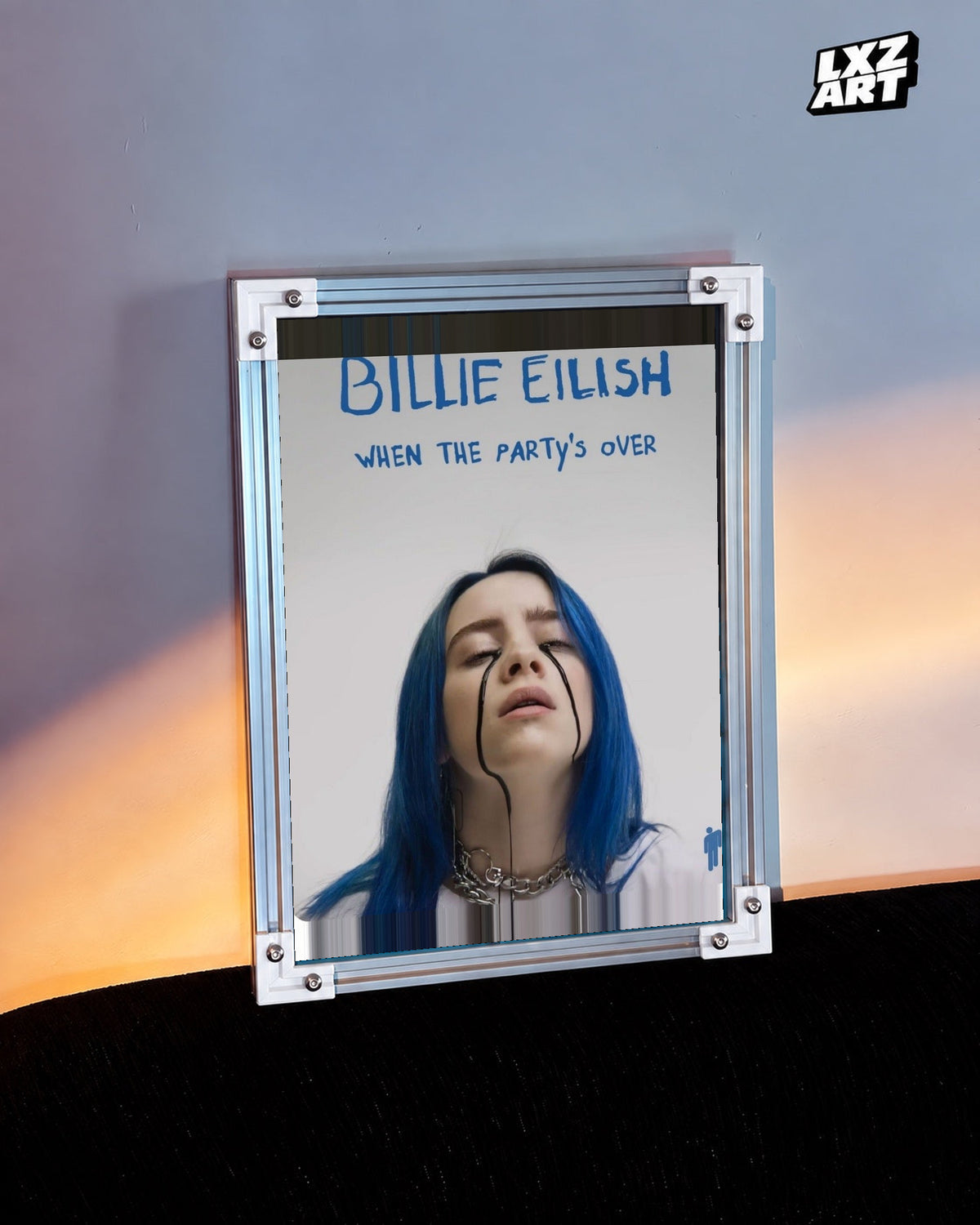 Billie Eilish When The Party’s Over Poster in white-corner frame beside warm-lit wall. Frame shown for display only.