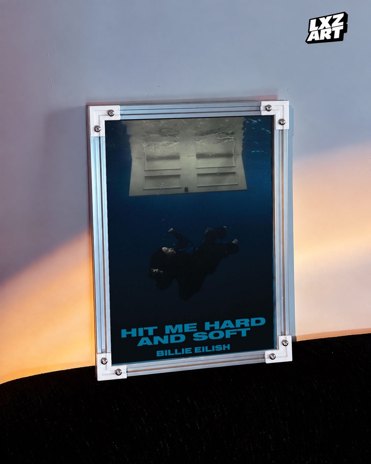 Billie Eilish Hit Me Hard and Soft Album Poster in white-corner frame beside warm-lit wall. Frame shown for display only.