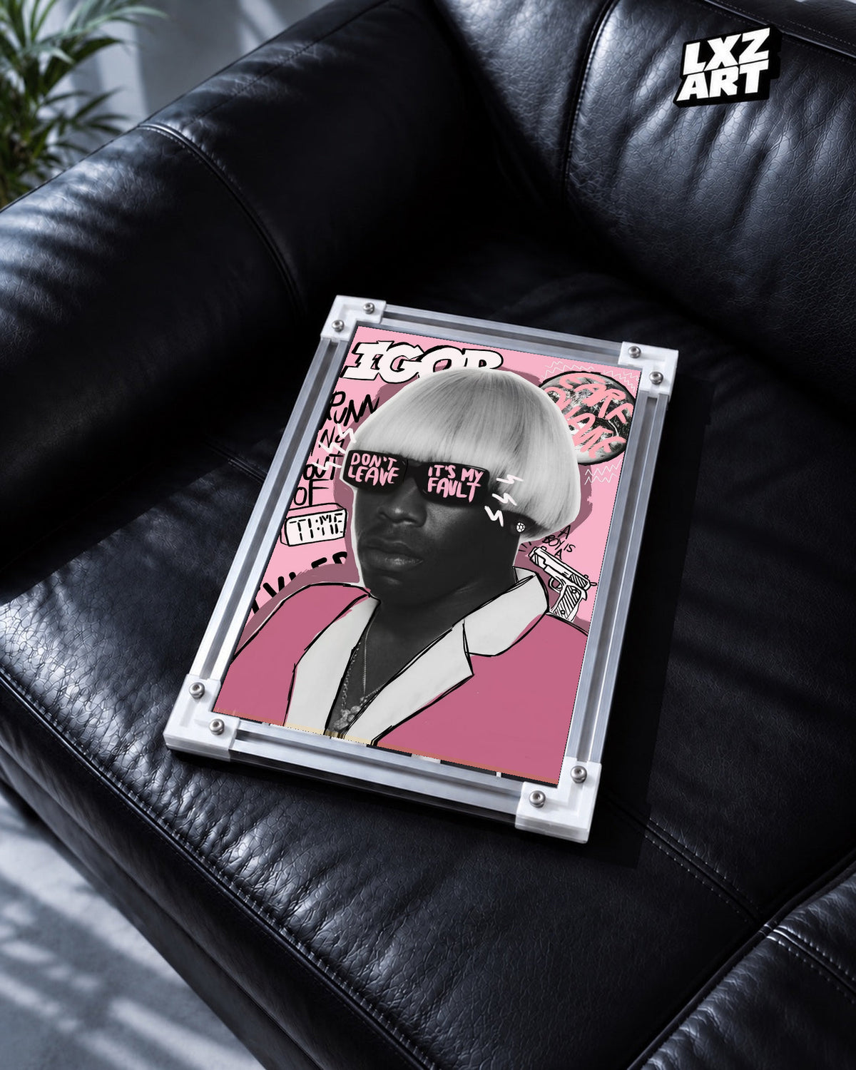 Tyler, The Creator IGOR Portrait Poster in white-corner frame on black leather sofa. Frame shown for display only.