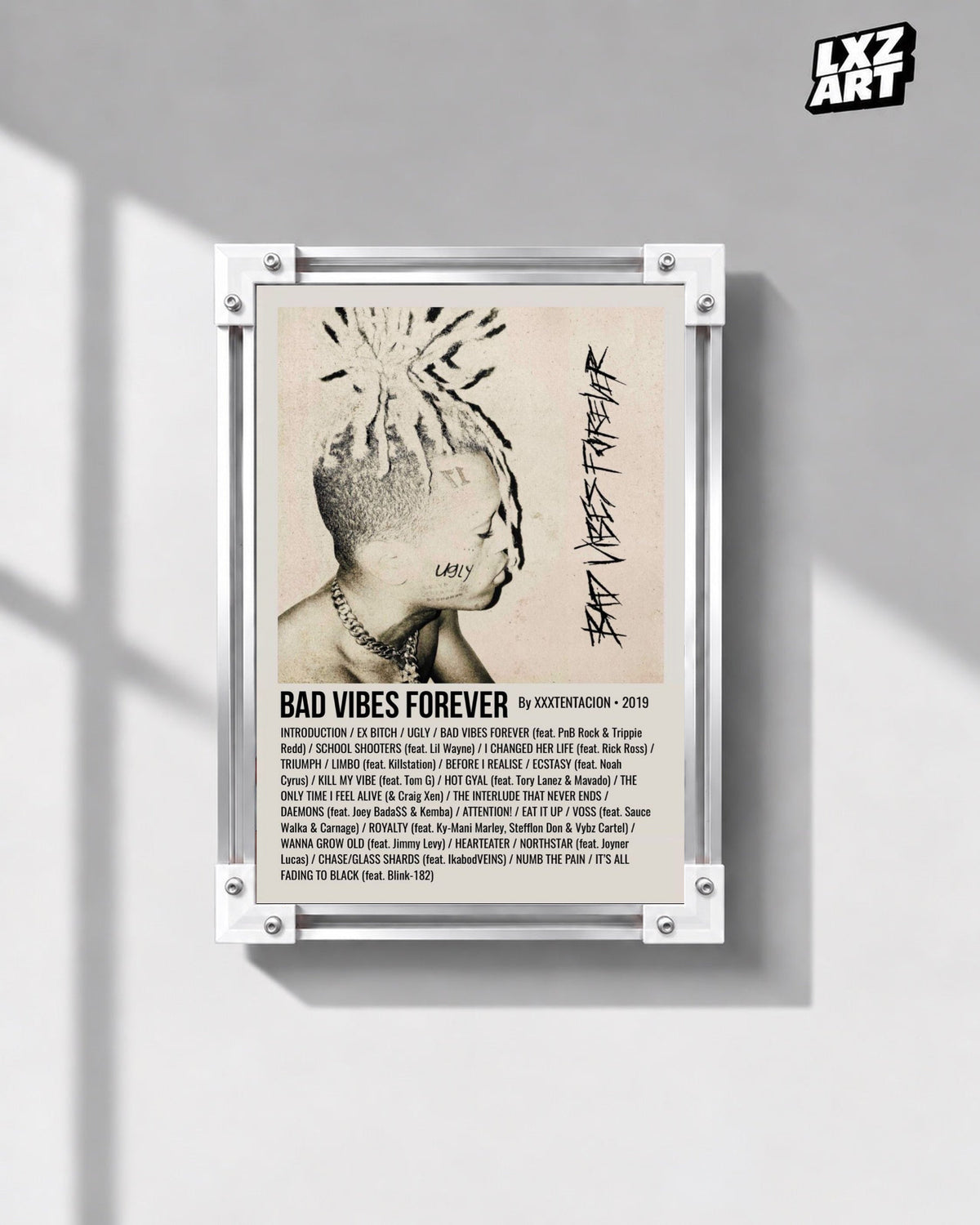 XXXTentacion Bad Vibes Forever Album Tracklist Poster in white-corner frame on gray wall. Frame shown for display only.