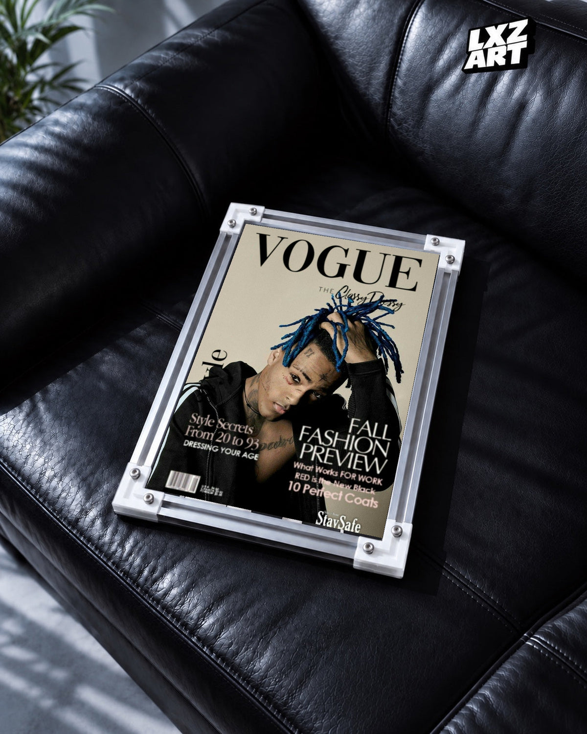 XXXTentacion Magazine Style Portrait Poster in white-corner frame on black leather sofa. Frame shown for display only.