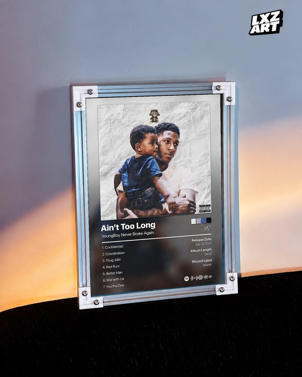 YoungBoy Never Broke Again Ain't Too Long Tracklist Poster in white-corner frame on warm-lit wall. Frame shown for display only.