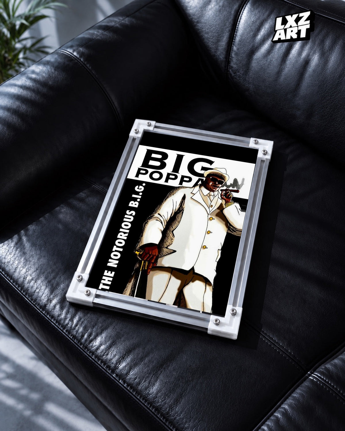The Notorious B.I.G. Big Poppa White Suit Illustration Poster in white-corner frame on black leather sofa. Frame shown for display only.