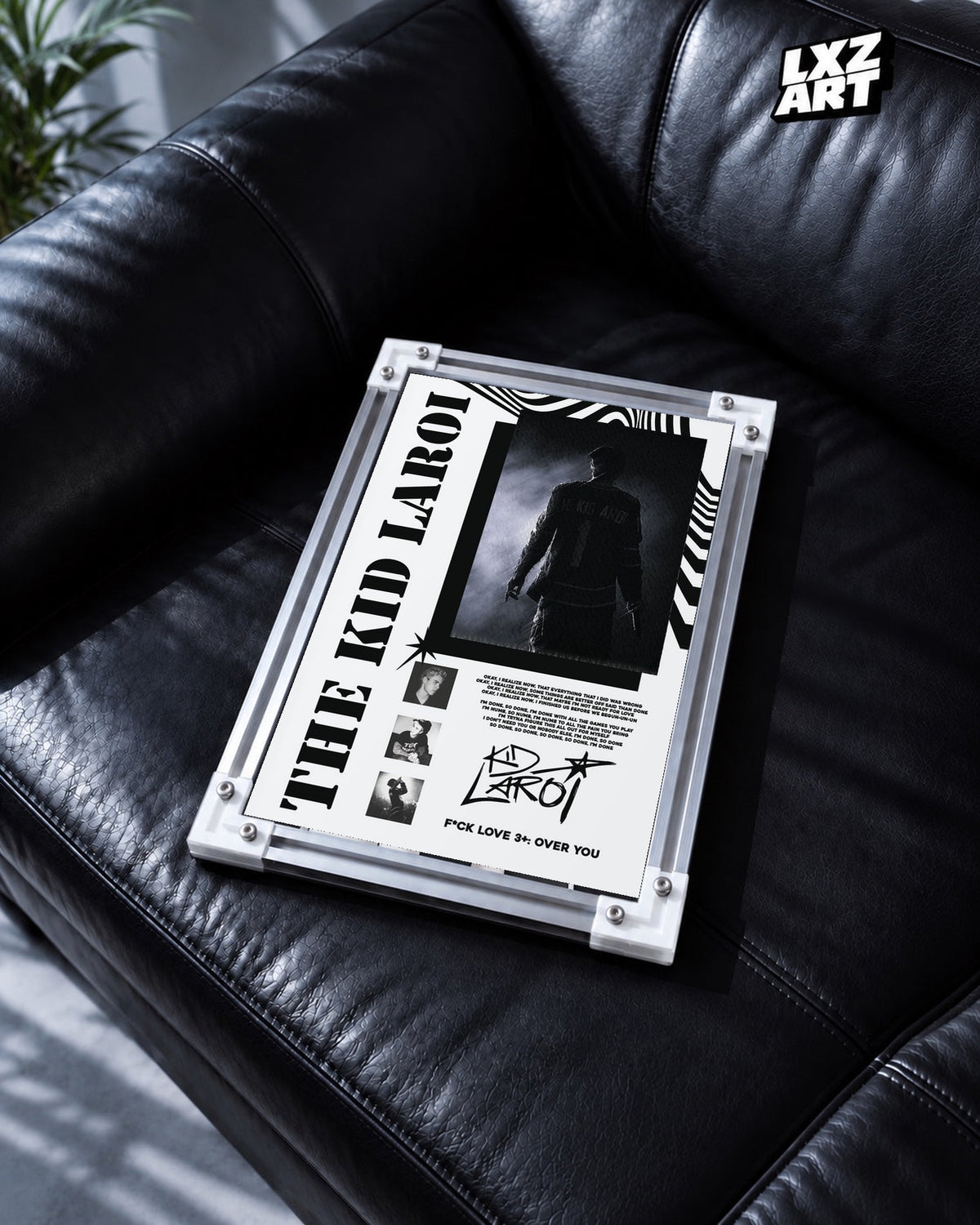 The Kid LAROI FLV3+: OVER YOU Black and White Collage Poster in white-corner frame on black leather sofa. Frame shown for display only.