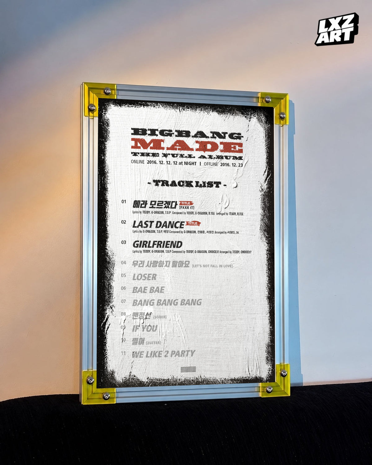 BIGBANG MADE Full Album Tracklist Poster displayed against a warm wall in a yellow-corner frame; unframed print, frame not included