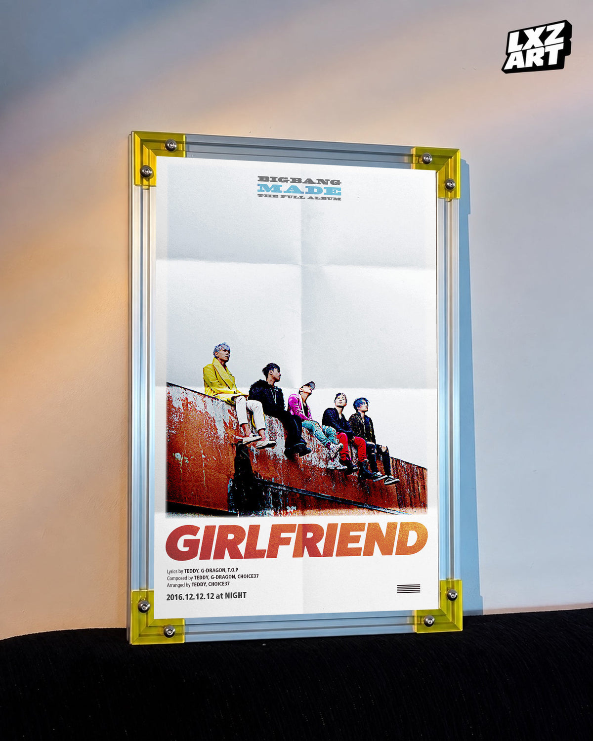 BIGBANG MADE Girlfriend Group Song Poster displayed against a warm wall in a yellow-corner frame; unframed print, frame not included