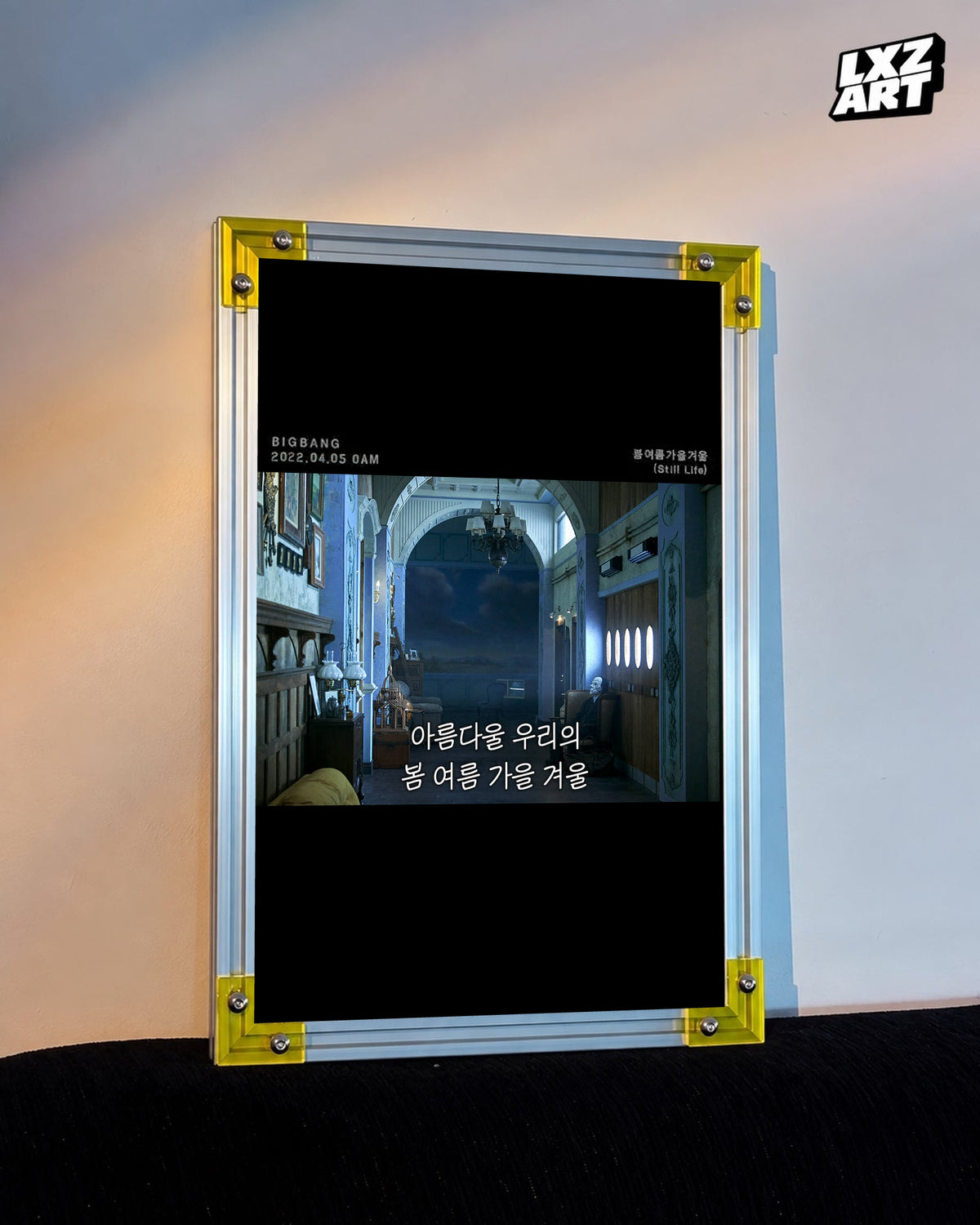 BIGBANG Still Life Blue Hall Lyric Poster displayed against a warm wall in a yellow-corner frame; unframed print, frame not included