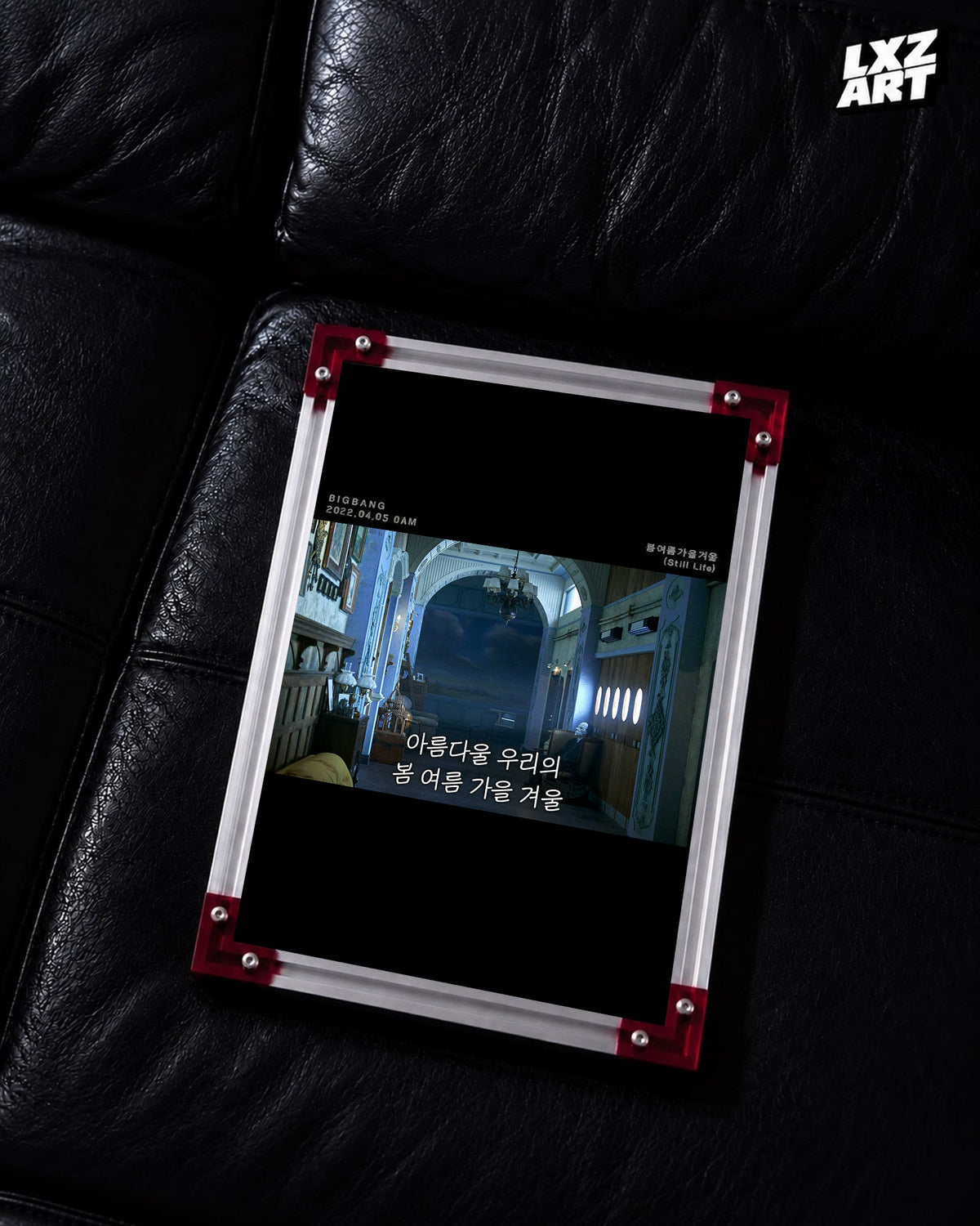 BIGBANG Still Life Blue Hall Lyric Poster displayed on a black leather sofa in a red-corner frame; unframed print, frame not included
