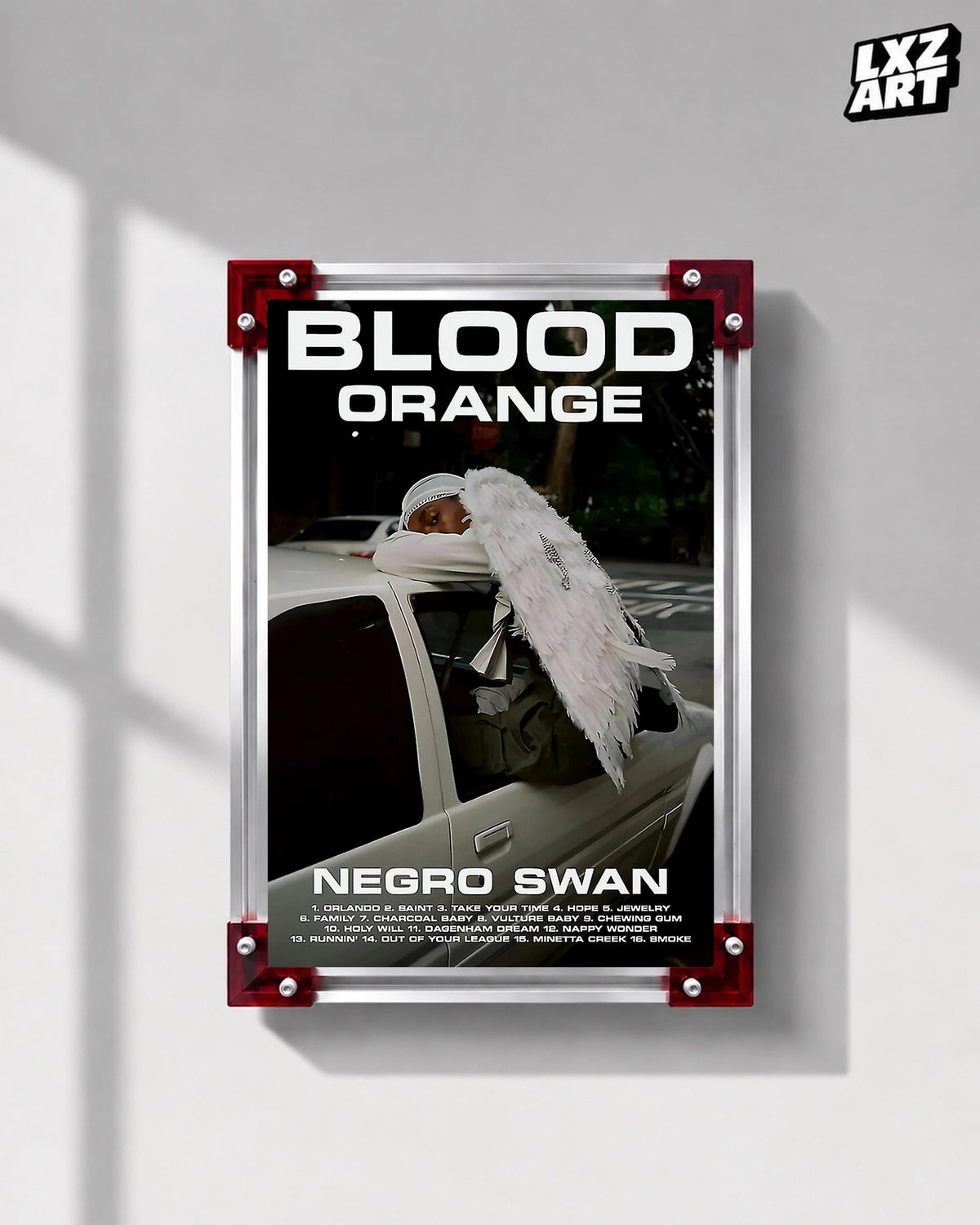 Blood Orange Negro Swan bold white type poster displayed on a gray wall in the red-corner frame; unframed print, frame not included