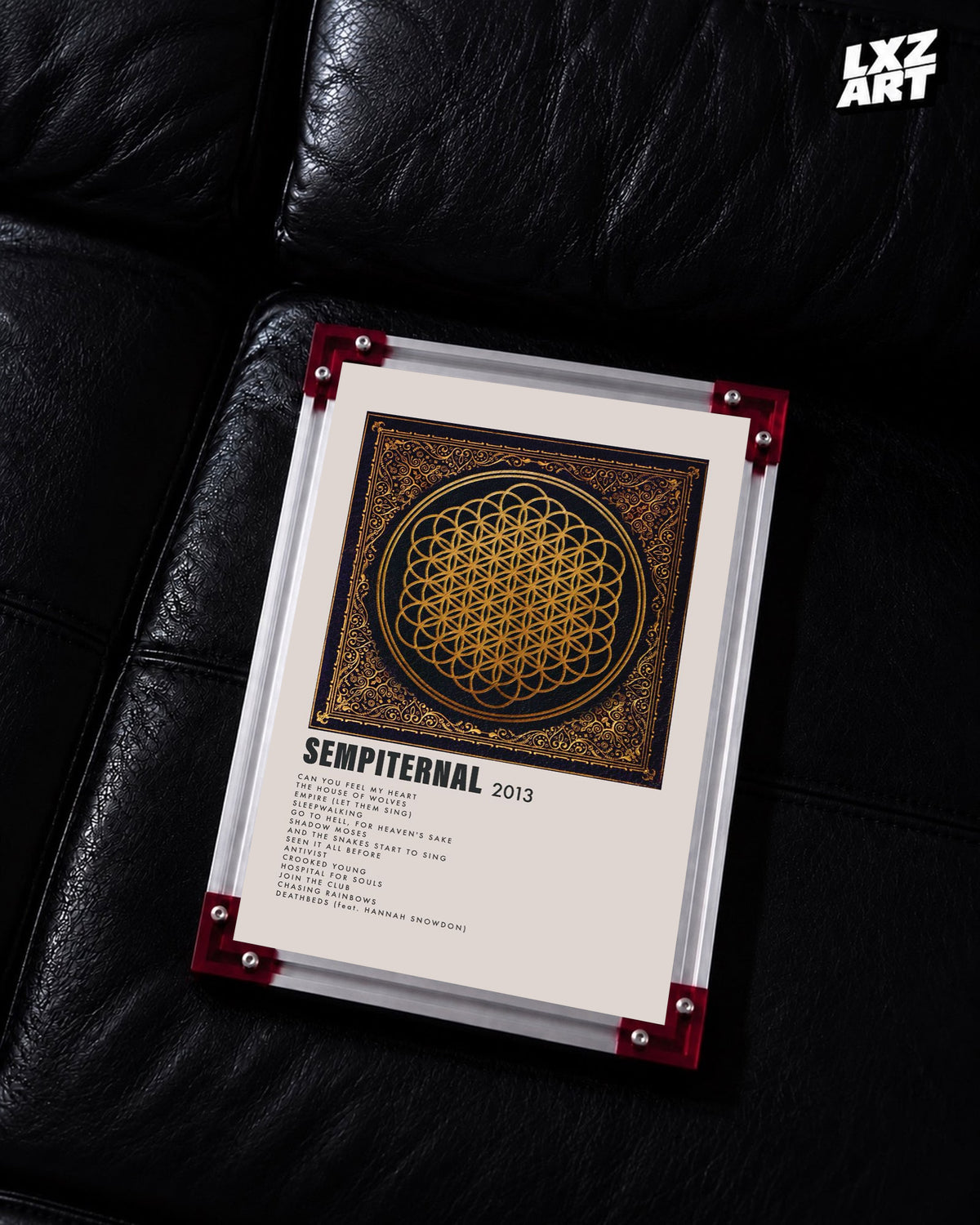 Bring Me The Horizon Sempiternal gold tracklist poster displayed on a black leather sofa in a red-corner frame; unframed print, frame not included