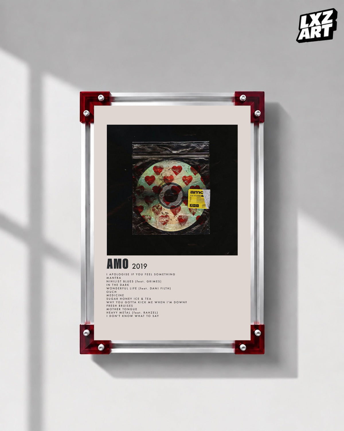 Bring Me The Horizon amo heart disc tracklist poster displayed on a gray wall in a red-corner frame; unframed print, frame not included