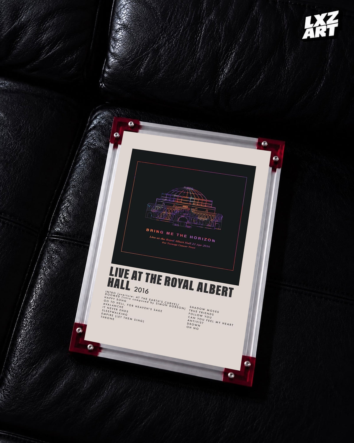 Bring Me The Horizon Live at the Royal Albert Hall concert tracklist poster displayed on a black leather sofa in a red-corner frame; unframed print, frame not included
