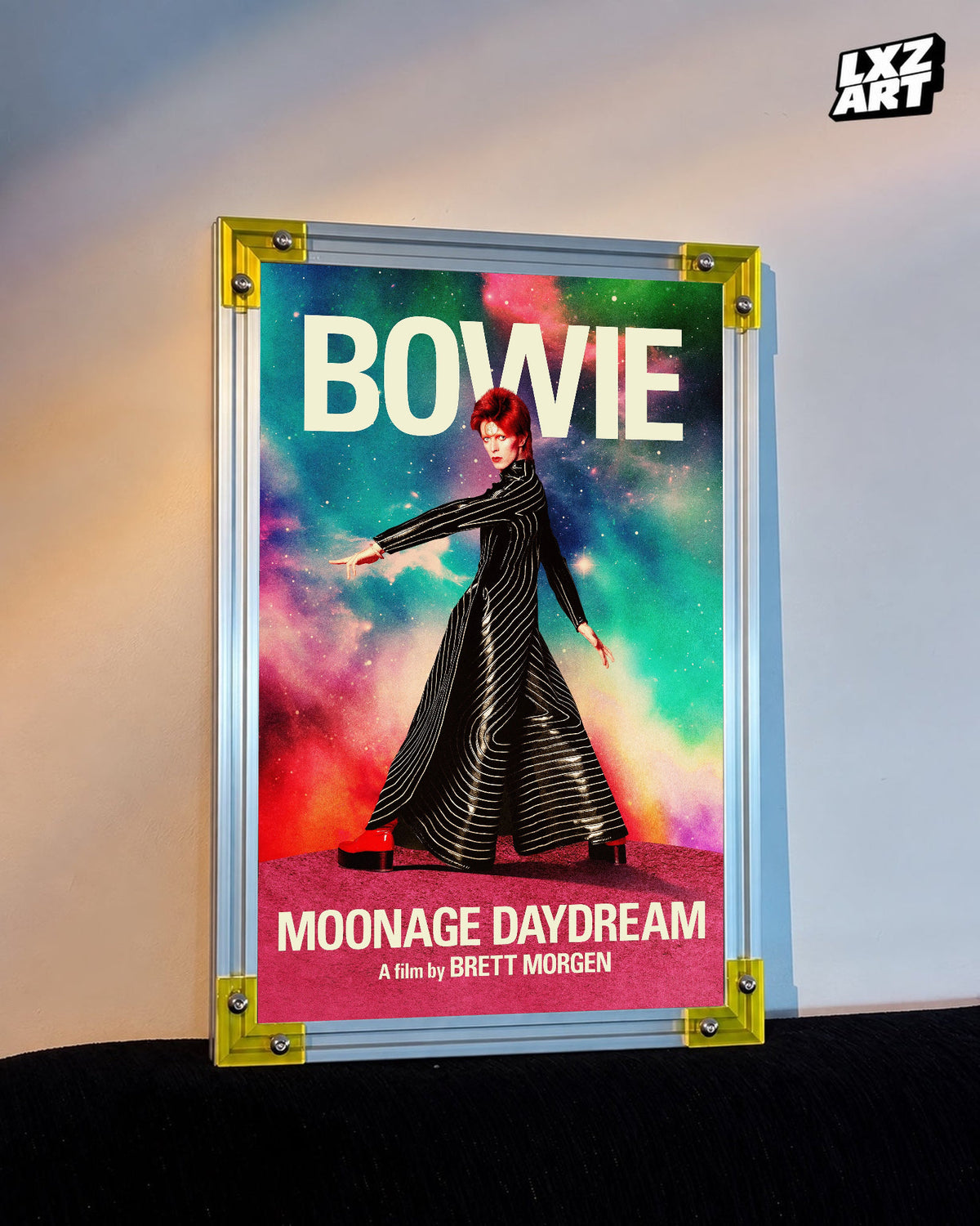 David Bowie Moonage Daydream Striped Suit poster displayed on warm wall with yellow frame corners; frame not included