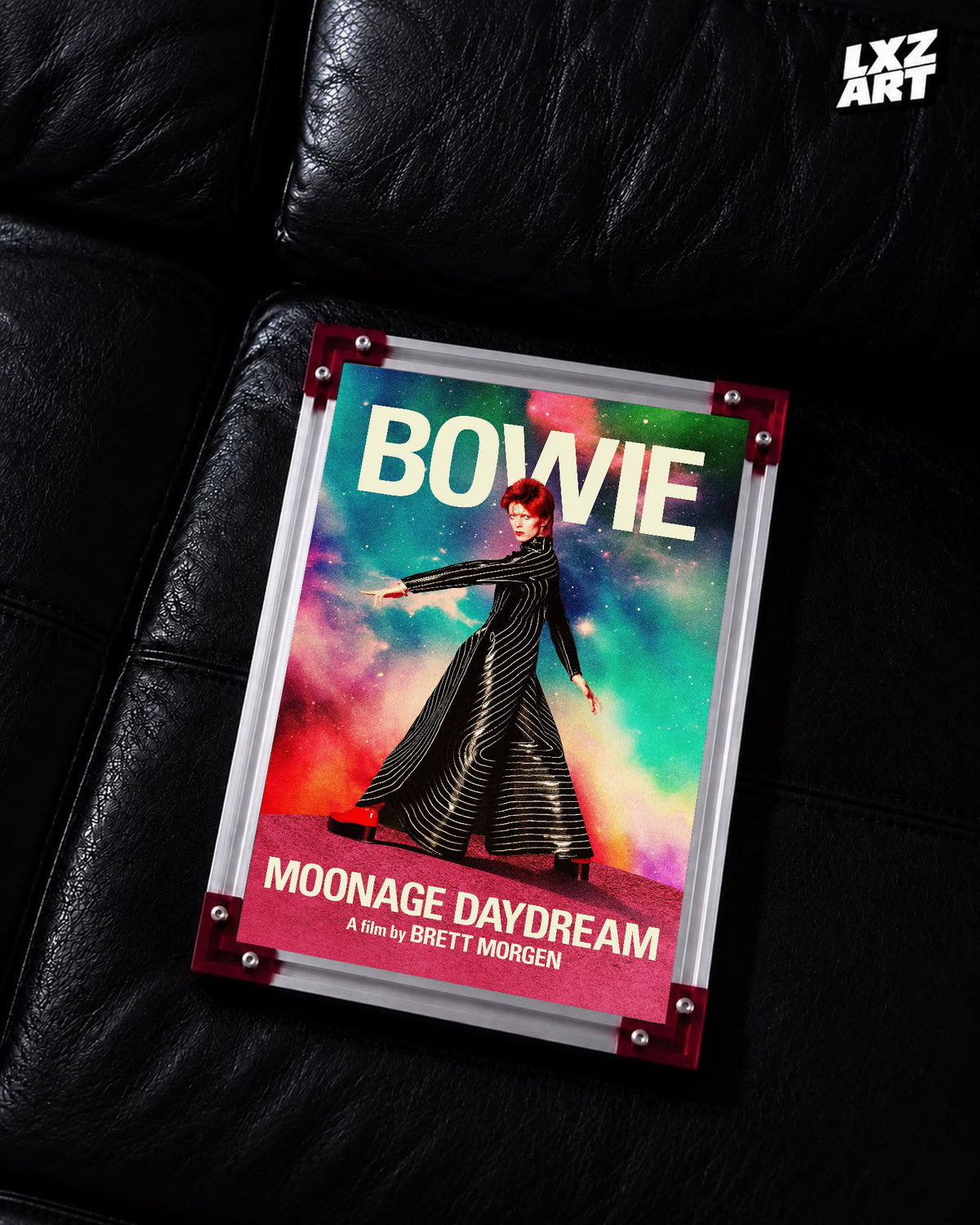 David Bowie Moonage Daydream Striped Suit poster displayed on black leather sofa with red frame corners; frame not included
