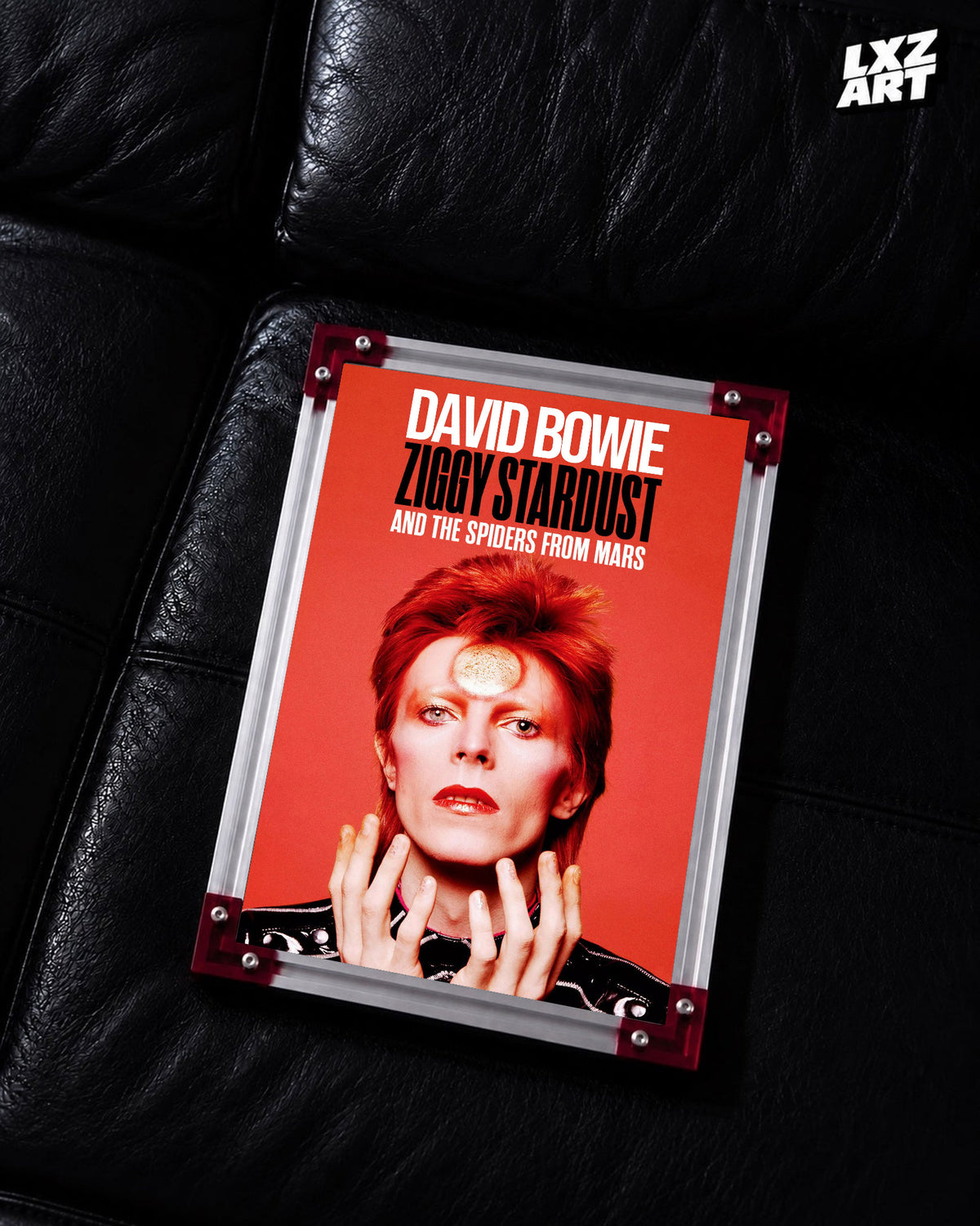 David Bowie Ziggy Stardust Red Portrait poster displayed on black leather sofa with red frame corners; frame not included