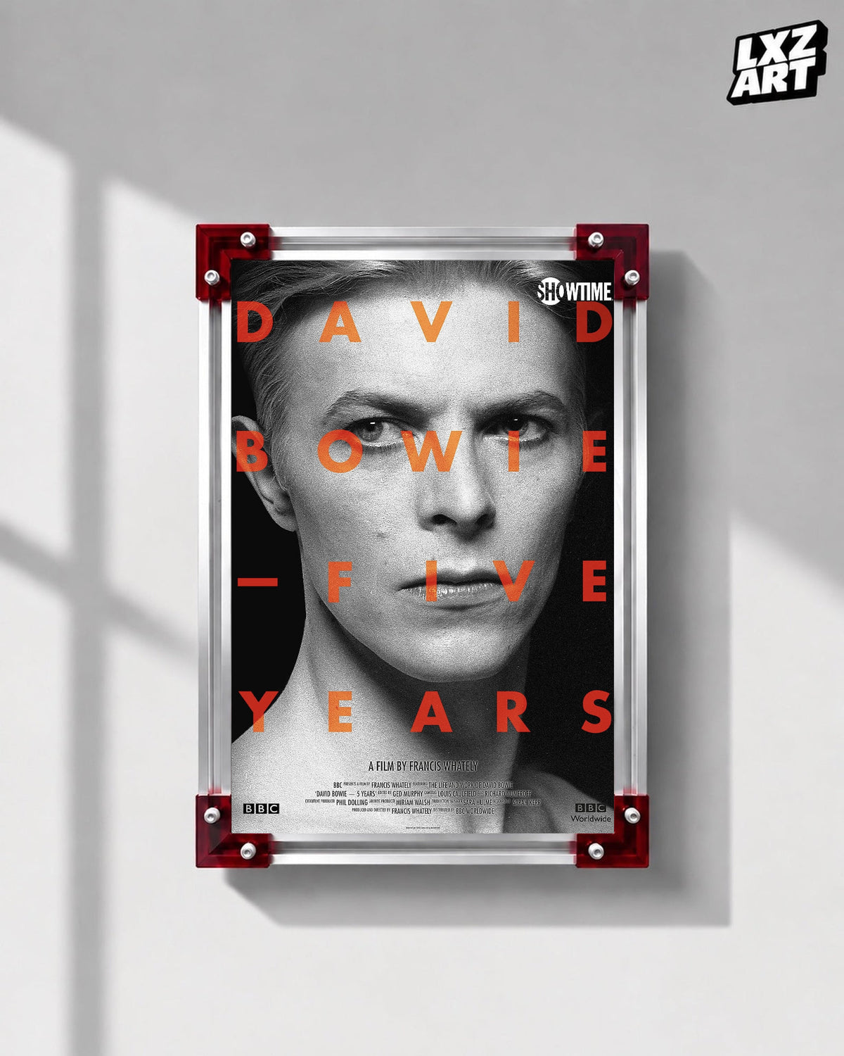 David Bowie Five Years Monochrome Portrait poster displayed on gray wall with red frame corners; frame not included