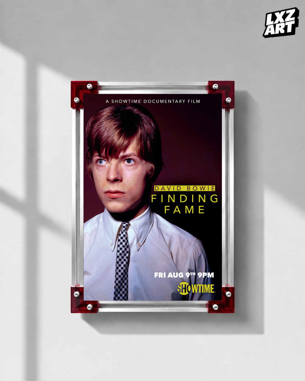 David Bowie Finding Fame Portrait poster displayed on gray wall with red frame corners; frame not included
