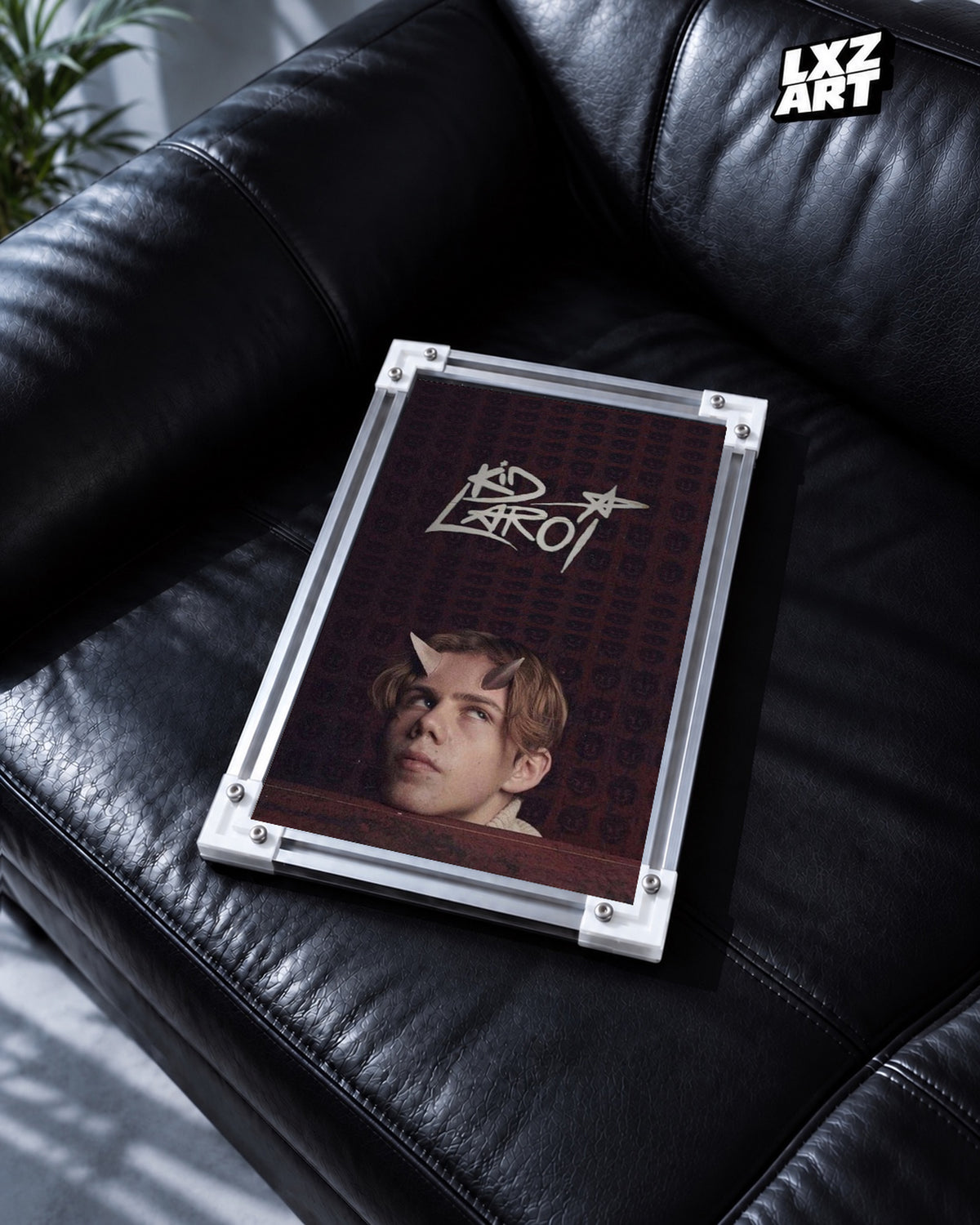 The Kid LAROI Burgundy Horned Portrait and Logo Poster | Unframed — black leather sofa display; unframed print, frame not included