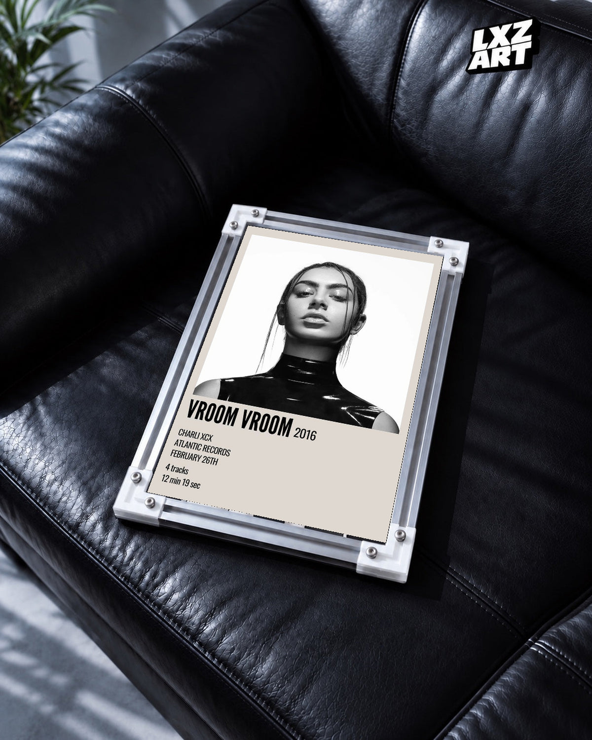 Charli xcx Vroom Vroom Monochrome Portrait unframed poster shown in the black leather sofa display.