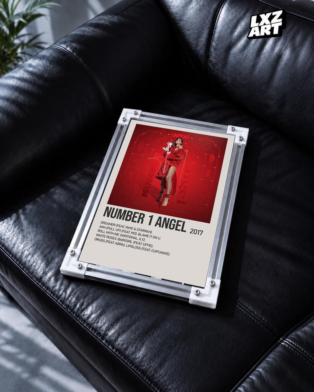 Charli xcx Number 1 Angel Red Tracklist unframed poster shown in the black leather sofa display.