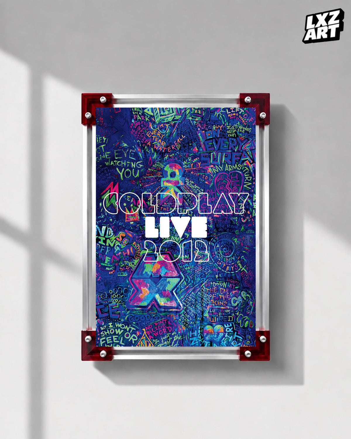 Coldplay Live 2012 Graffiti Concert Film Poster displayed on a gray wall in a red-corner frame; unframed print, frame not included