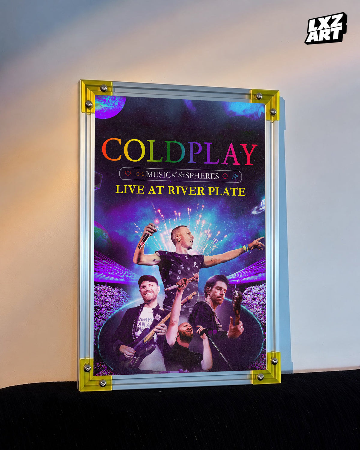 Coldplay Music of the Spheres Live at River Plate Poster displayed against a warm wall in a yellow-corner frame; unframed print, frame not included