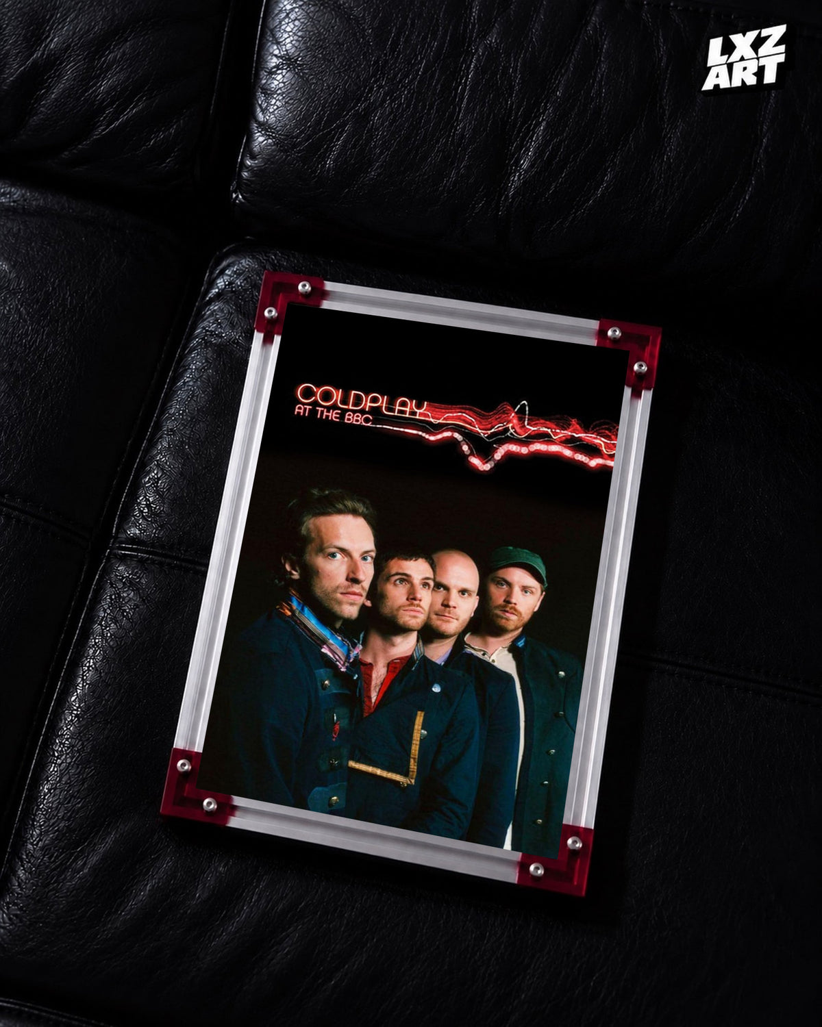 Coldplay At the BBC 2008 Poster displayed on a black leather sofa in a red-corner frame; unframed print, frame not included