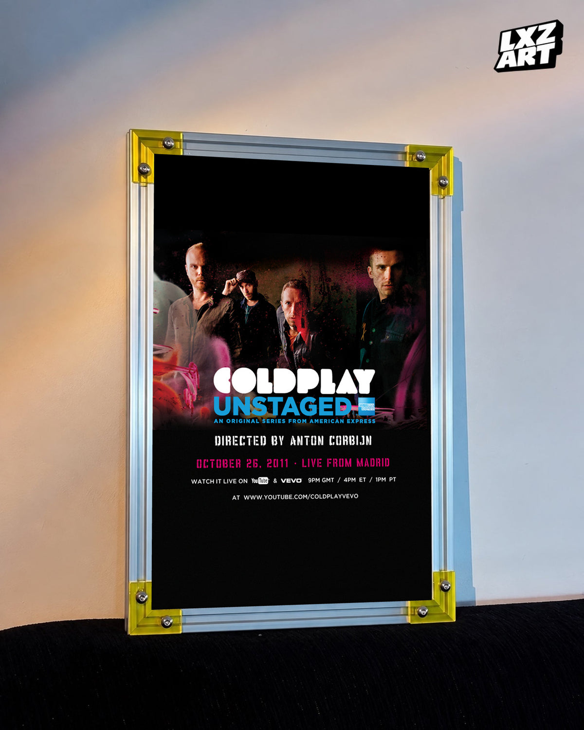 Coldplay Unstaged Live From Madrid 2011 Poster displayed against a warm wall in a yellow-corner frame; unframed print, frame not included