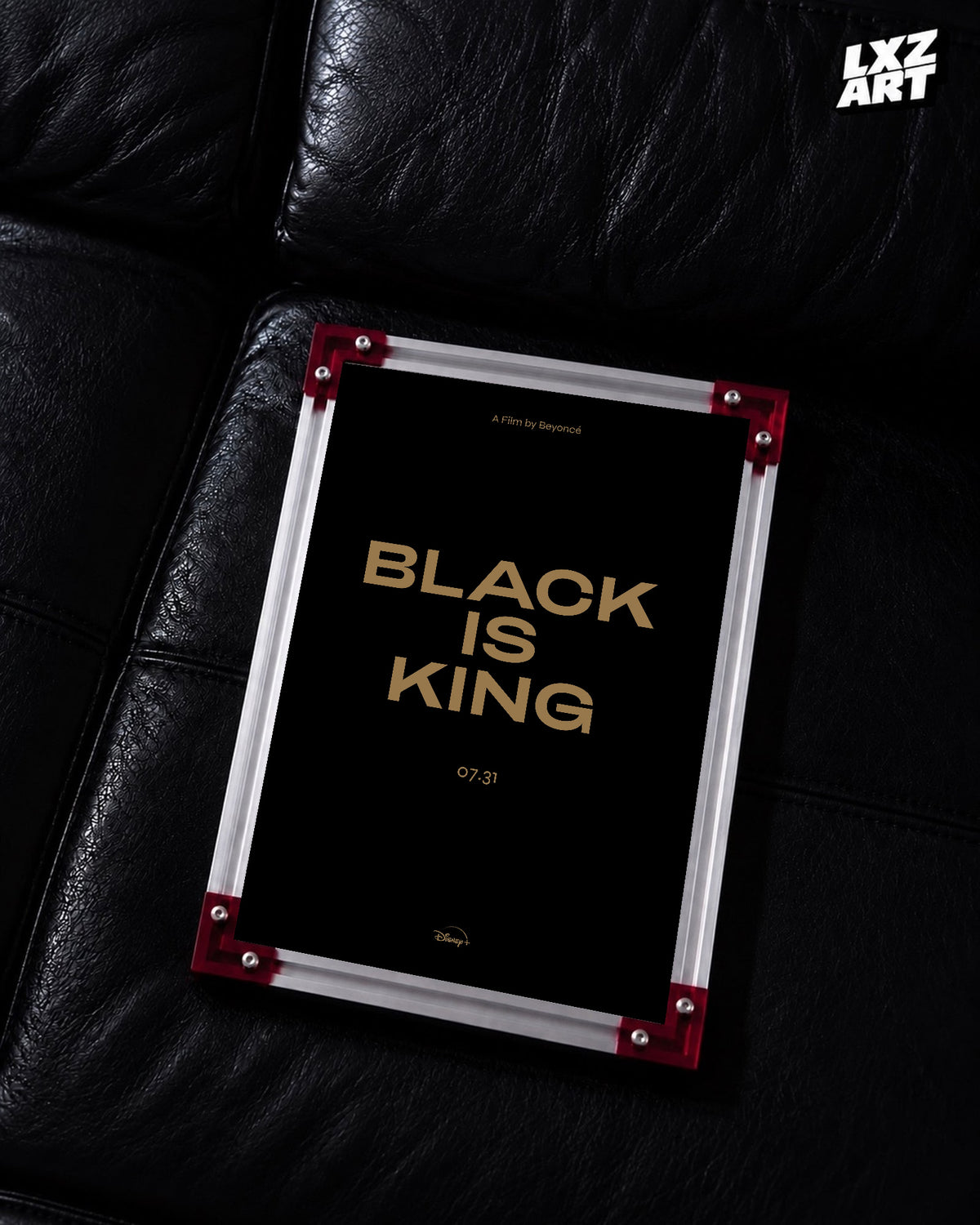 Beyoncé Black Is King film poster displayed on a black leather sofa in a red corner frame; unframed print, frame not included