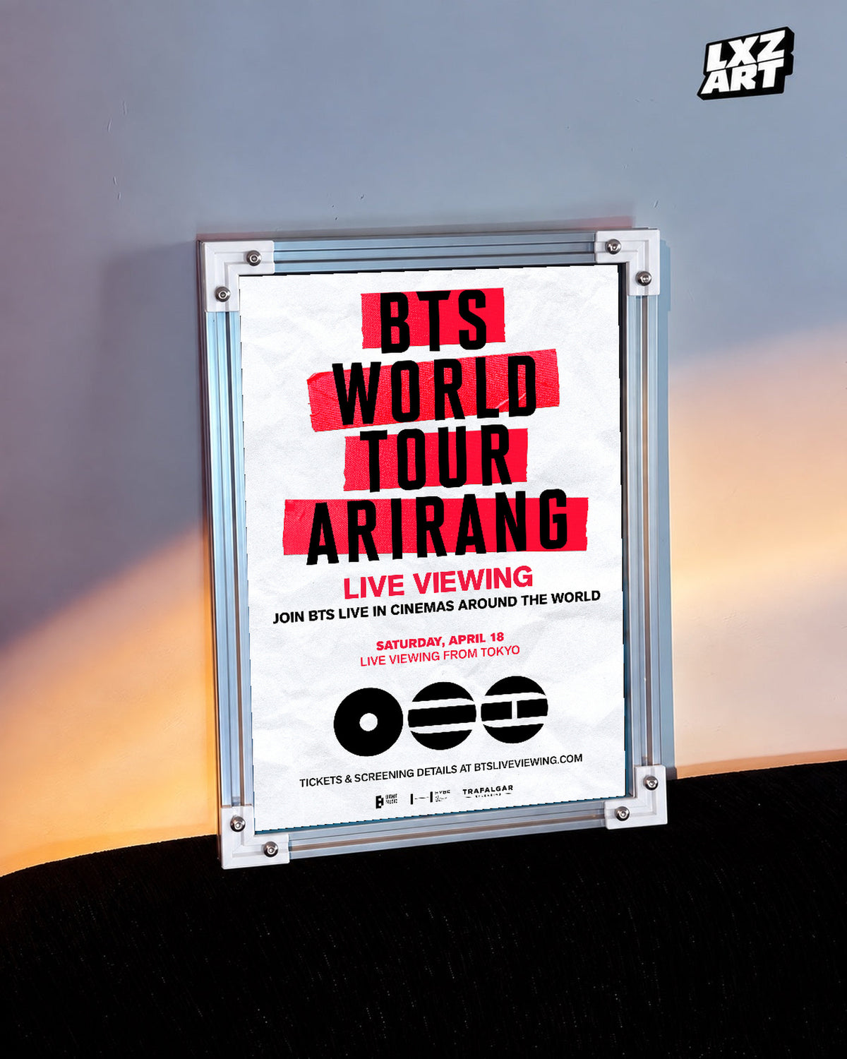 BTS World Tour ARIRANG in Japan Live Viewing poster in the LXZART warm-lit wall display. Unframed print; frame shown for display only.