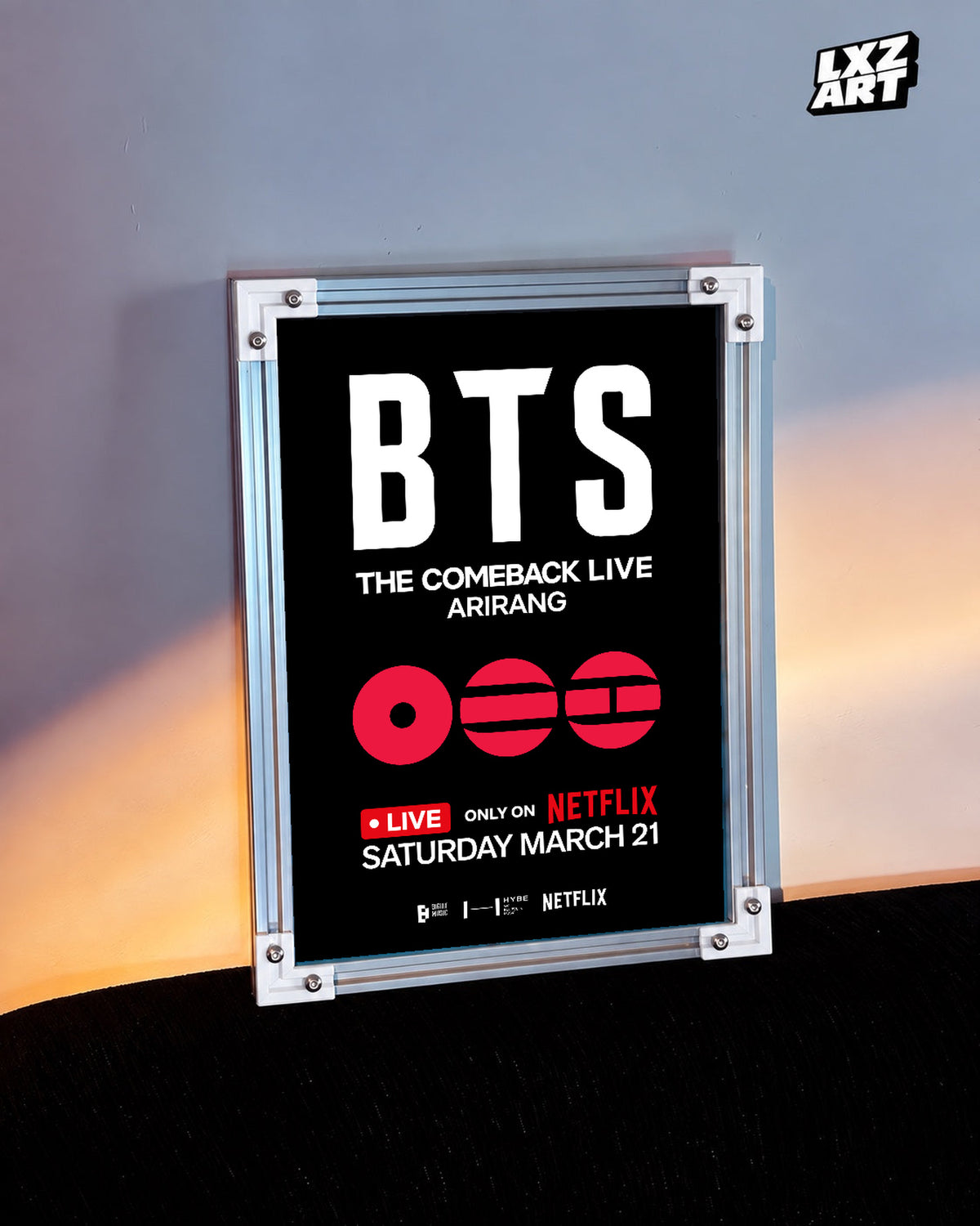 BTS The Comeback Live ARIRANG poster in the LXZART warm-lit wall display. Unframed print; frame shown for display only.