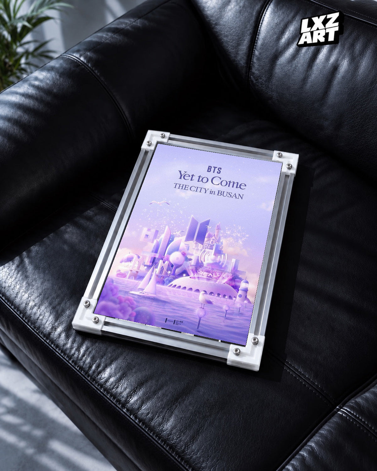 BTS Yet To Come The City in Busan poster in the LXZART black leather sofa display. Unframed print; frame shown for display only.