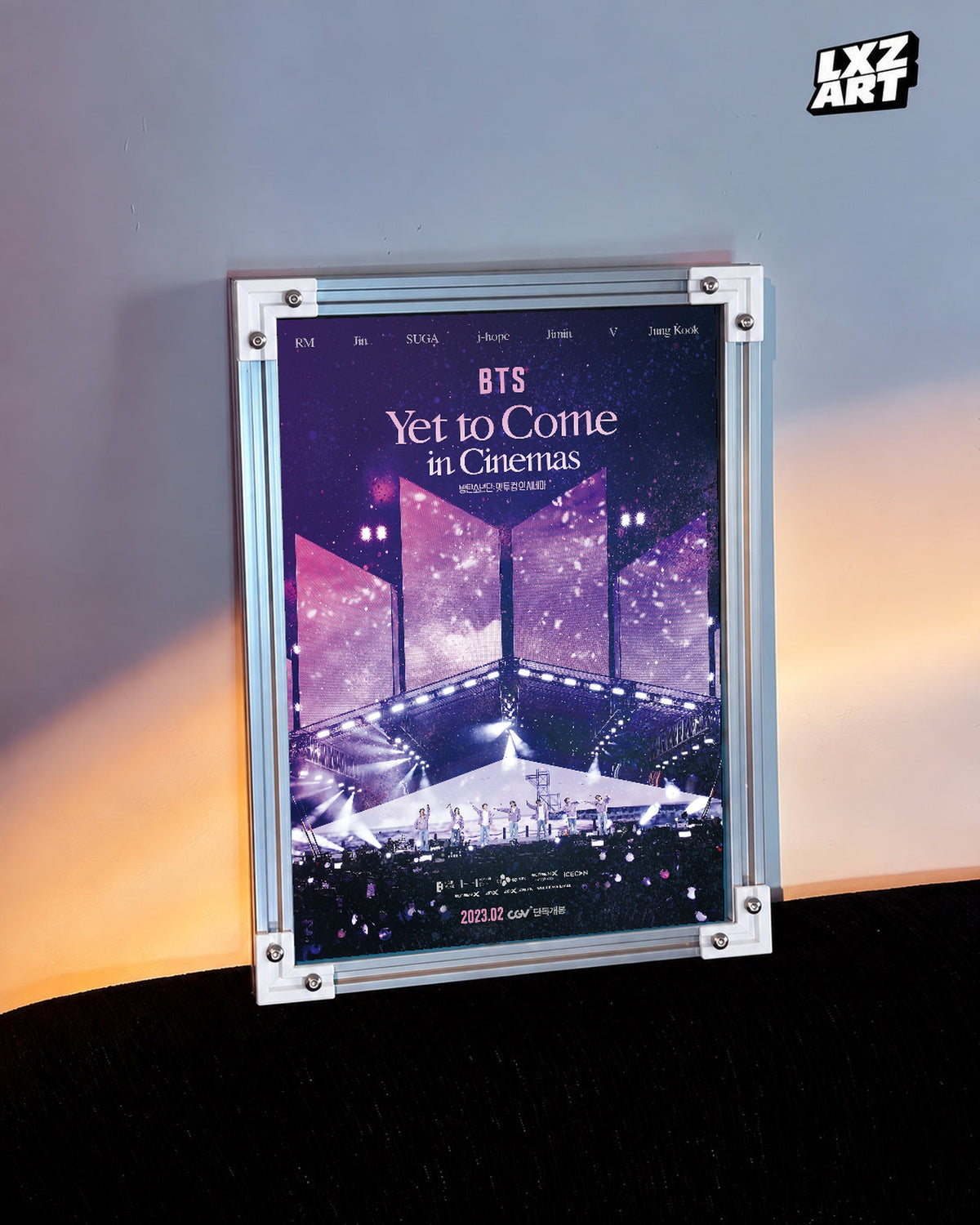 BTS Yet To Come in Cinemas poster in the LXZART warm-lit wall display. Unframed print; frame shown for display only.