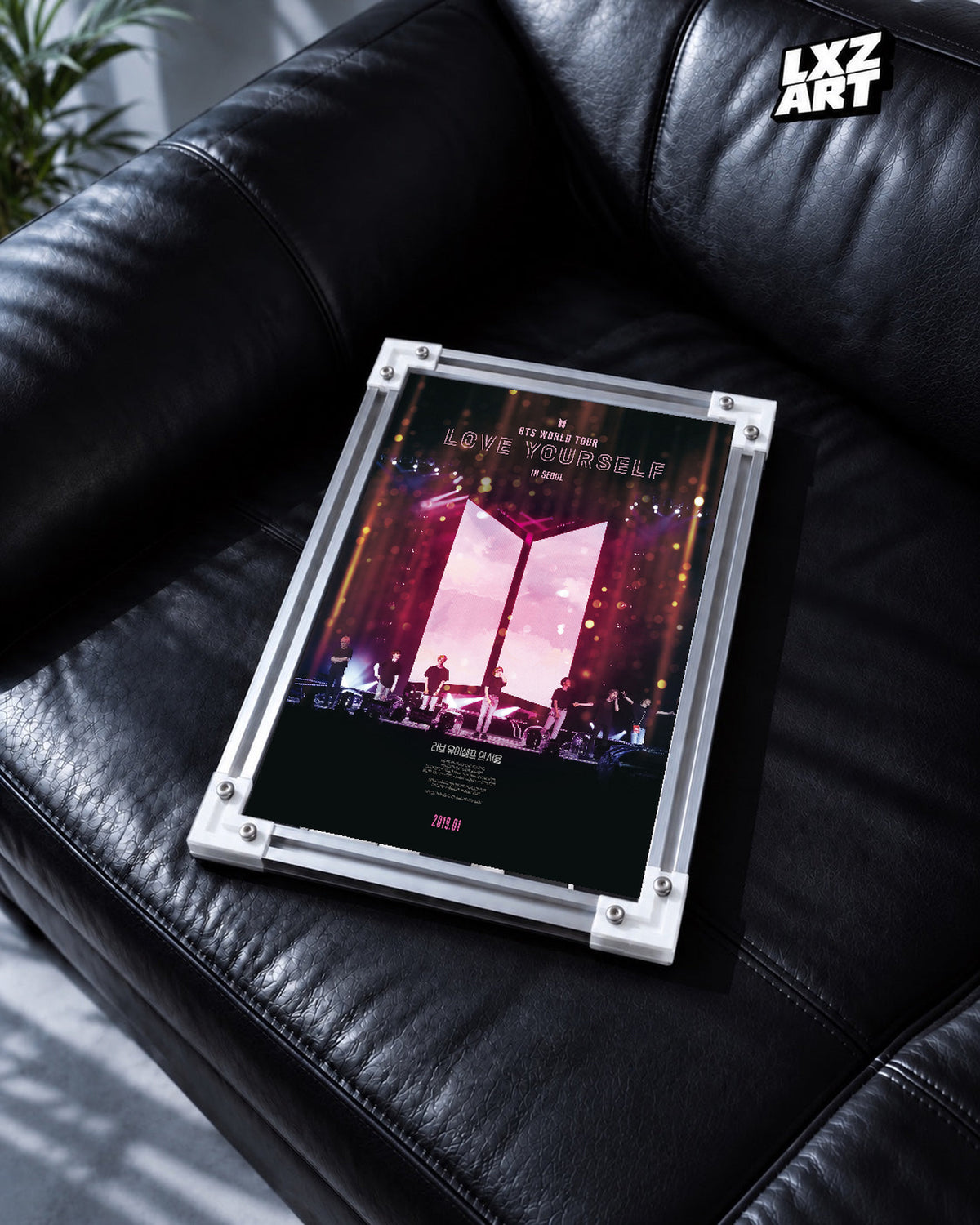 BTS World Tour Love Yourself in Seoul poster in the LXZART black leather sofa display. Unframed print; frame shown for display only.