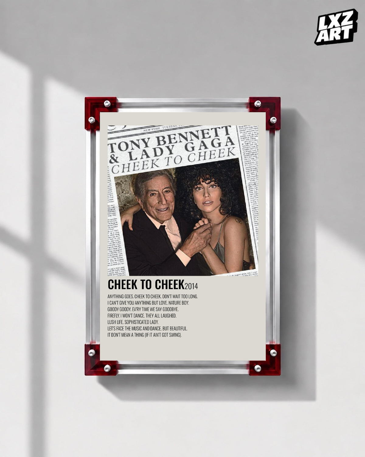 Lady Gaga & Tony Bennett Cheek to Cheek tracklist poster displayed on a gray wall in a red corner frame; unframed print, frame not included