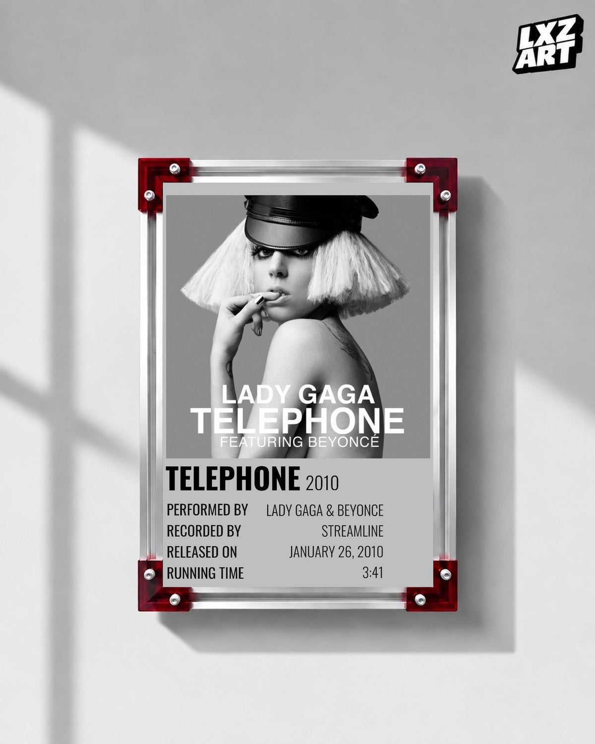 Lady Gaga feat. Beyoncé Telephone single cover poster displayed on a gray wall in a red corner frame; unframed print, frame not included