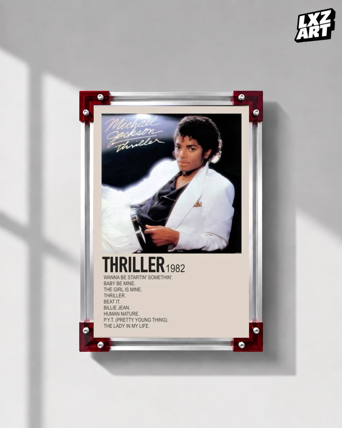 Michael Jackson Thriller tracklist poster displayed on a gray wall in a red corner frame; unframed print, frame not included