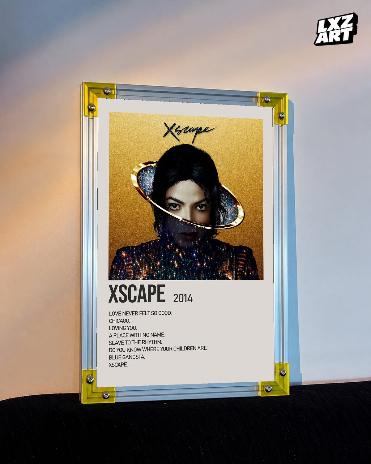 Michael Jackson Xscape Gold tracklist poster displayed against a warm wall in a yellow corner frame; unframed print, frame not included