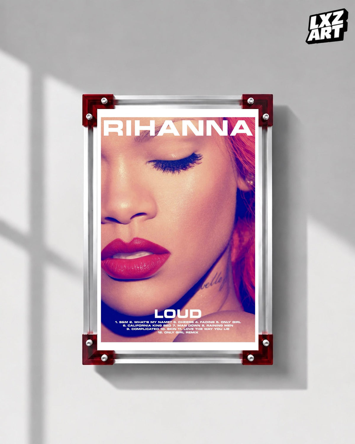 Rihanna Loud album tracklist poster displayed on a gray wall in a red corner frame; unframed print, frame not included