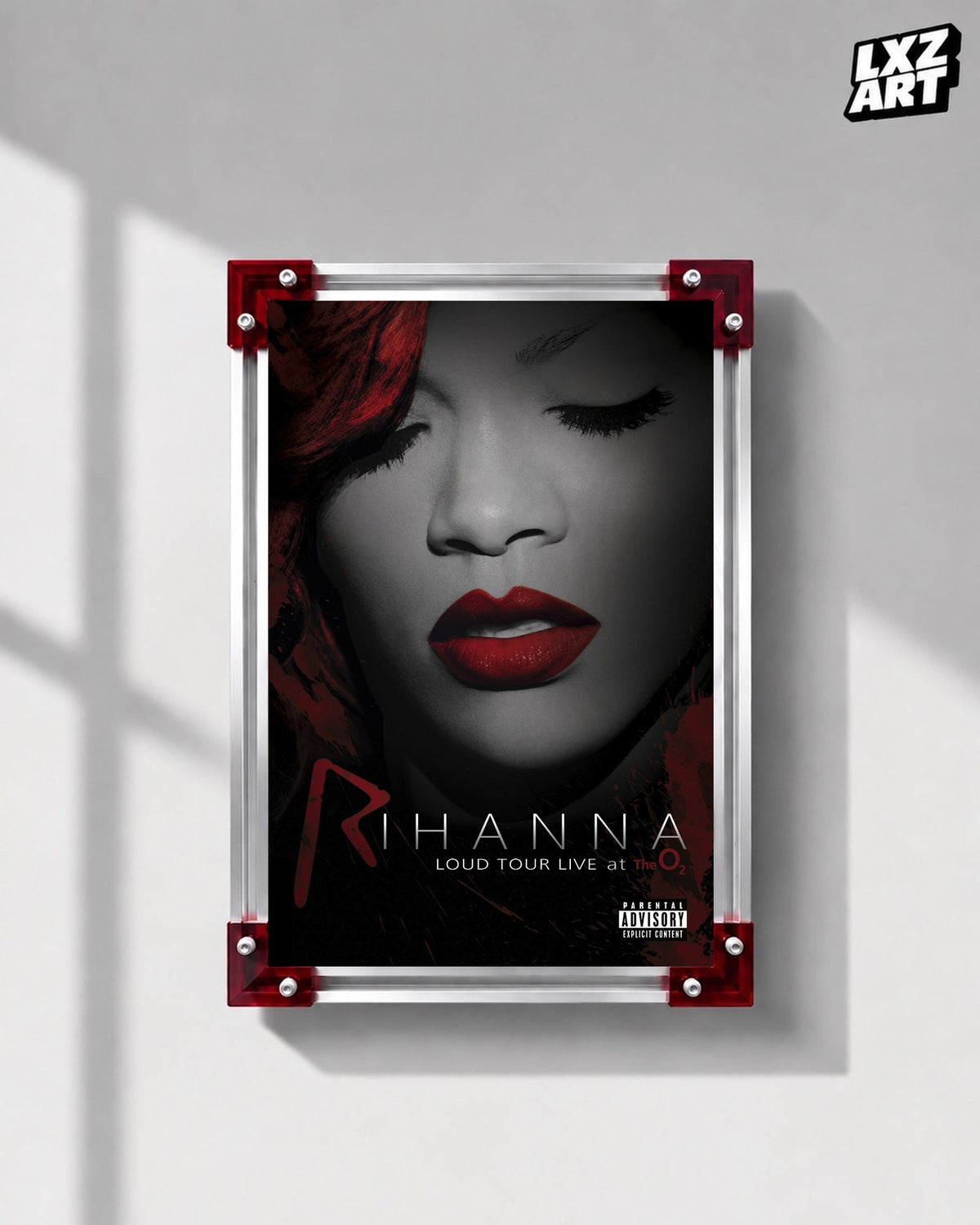 Rihanna Loud Tour Live at the O2 concert film poster displayed on a gray wall in a red corner frame; unframed print, frame not included